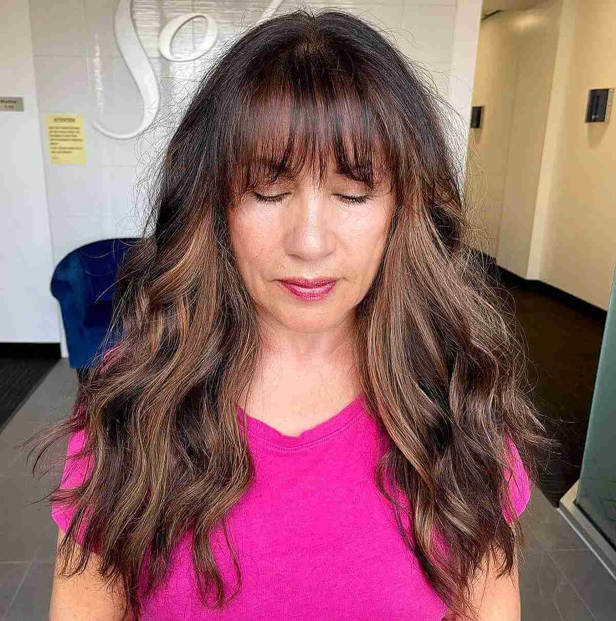 dimensional long brunette hairstyles for women over fifty