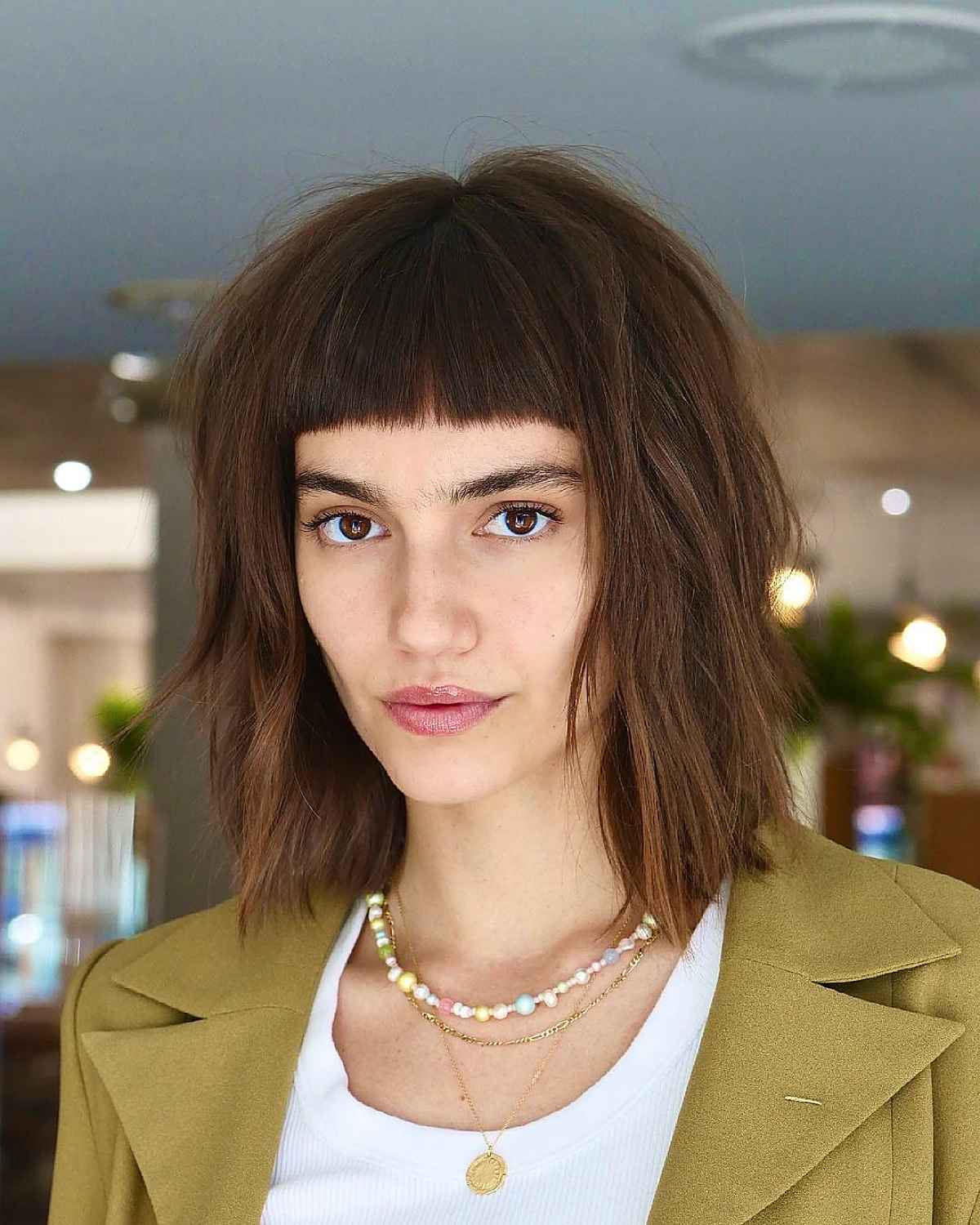 edgy shag cut with blunt bangs