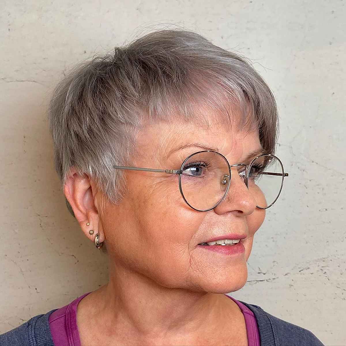 grey pixie hair with asymmetrical bangs for ladies over 60