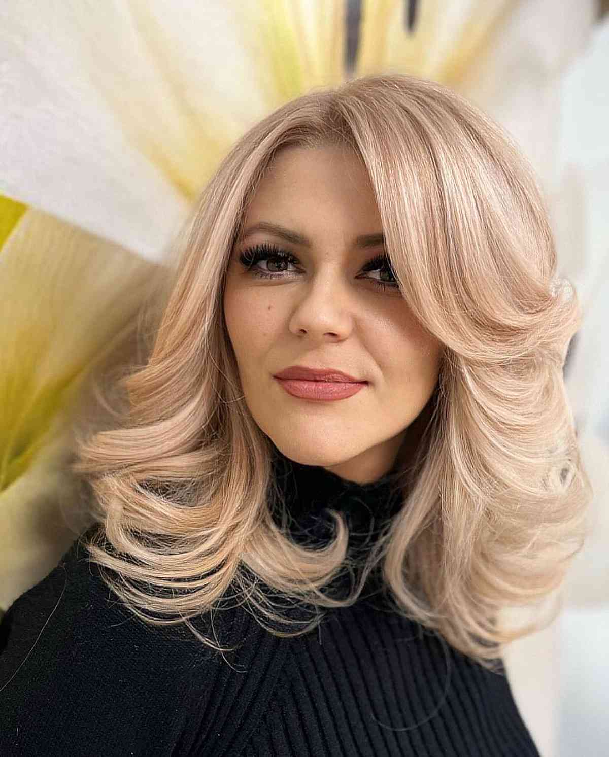 light honey blonde feathered lob for heart faces