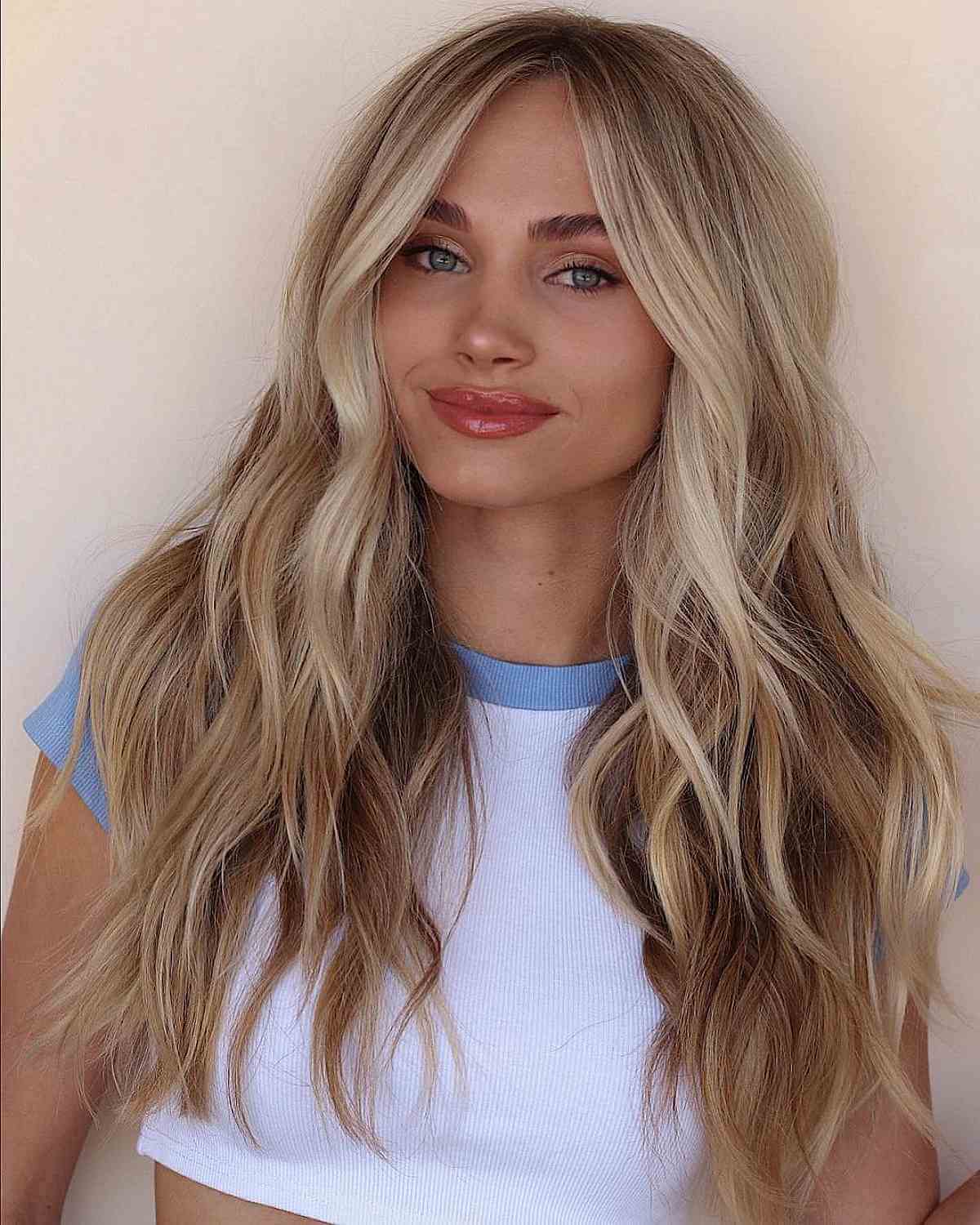 long blonde hair with a middle part for heart faces