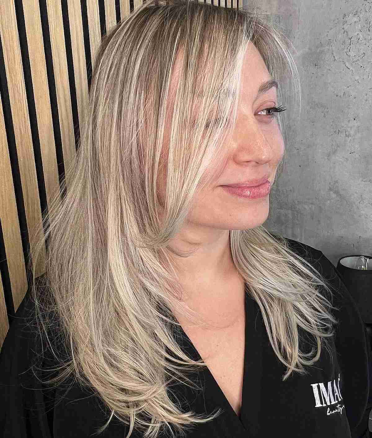 long blonde layers and face framing pieces for thinning hair