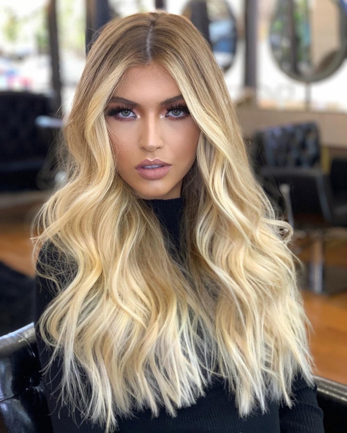long hair with a center part and a heart face shape