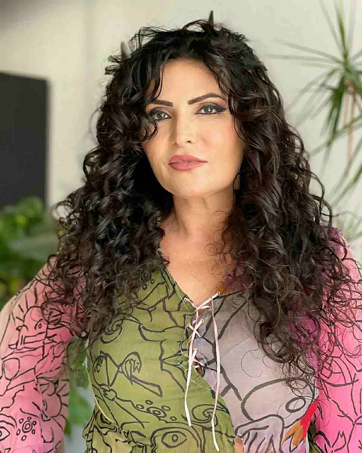 long hairstyle for over 50 woman with curly hair