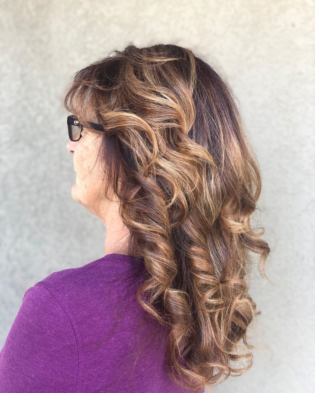 long hairstyles for woman over 50 with glasses