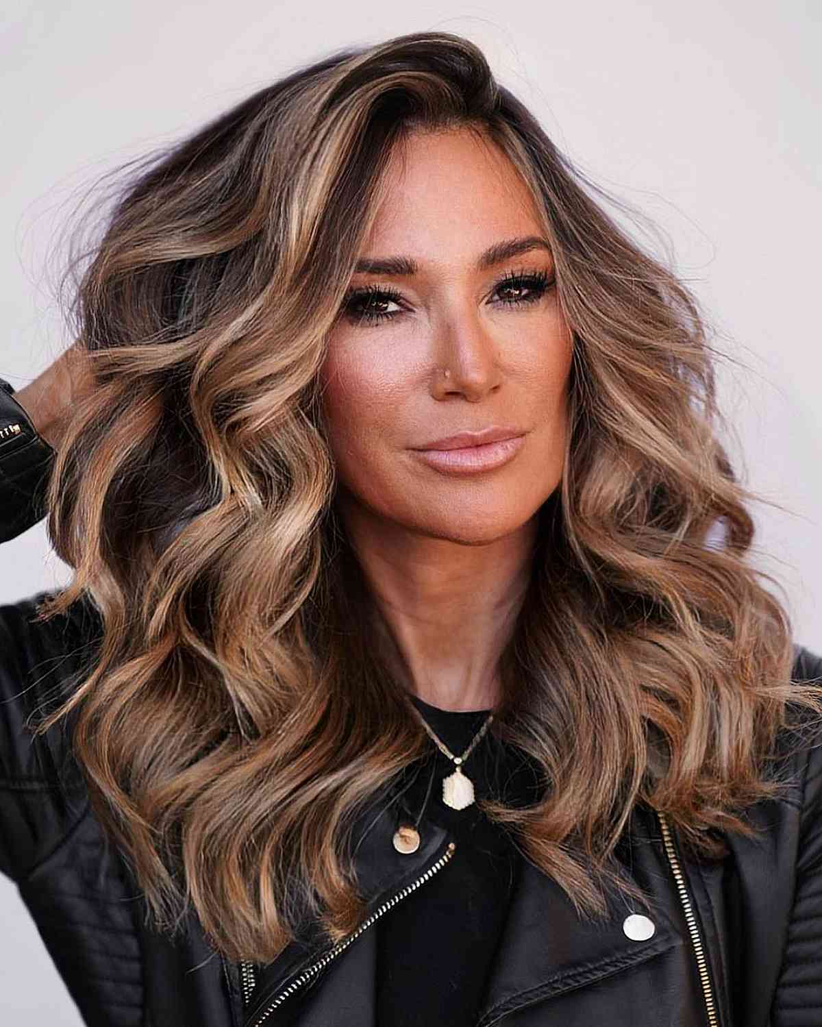 medium brown balayage with loose curls for ladies 40 and over
