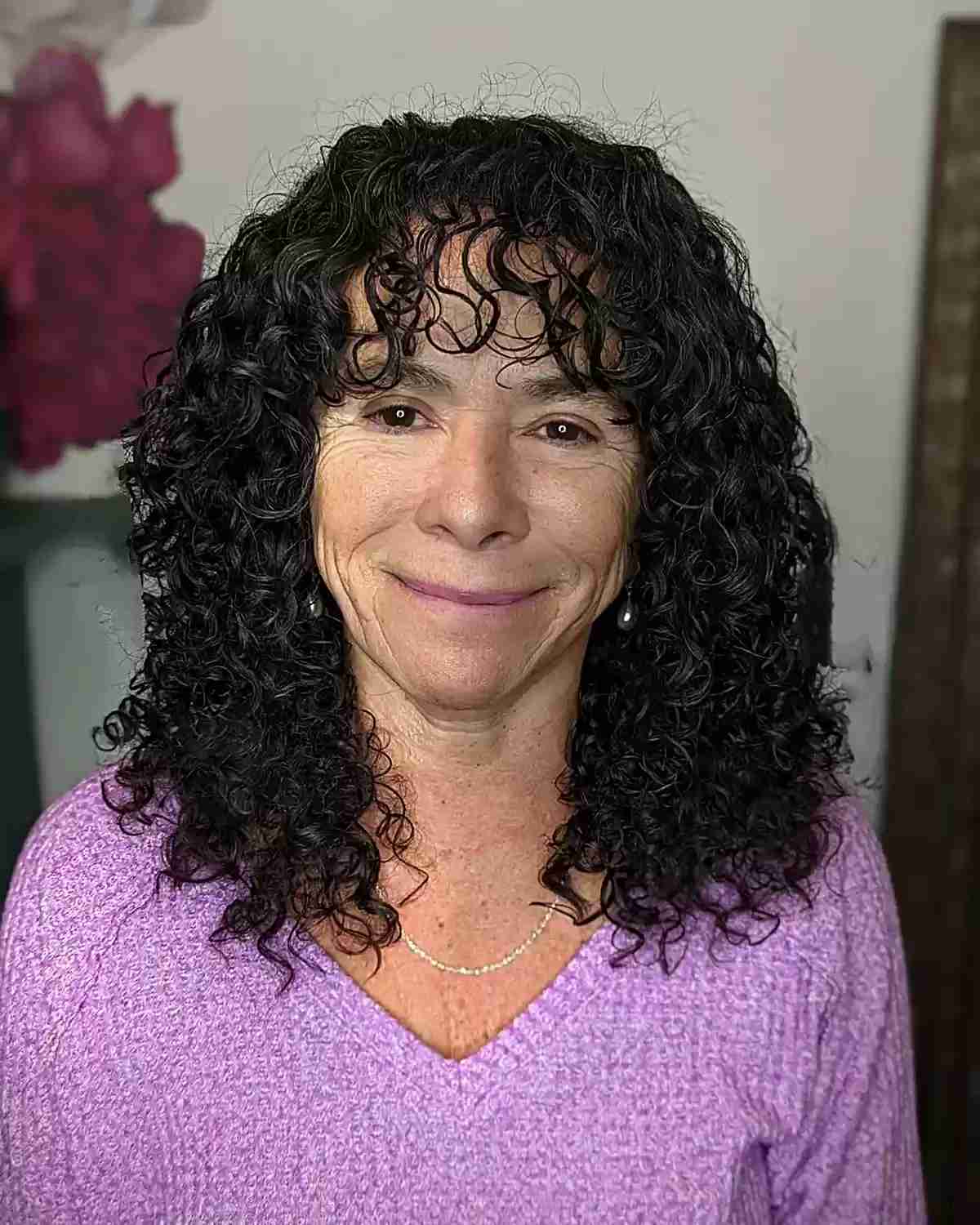 medium length curls with piecey bangs for older women over 60