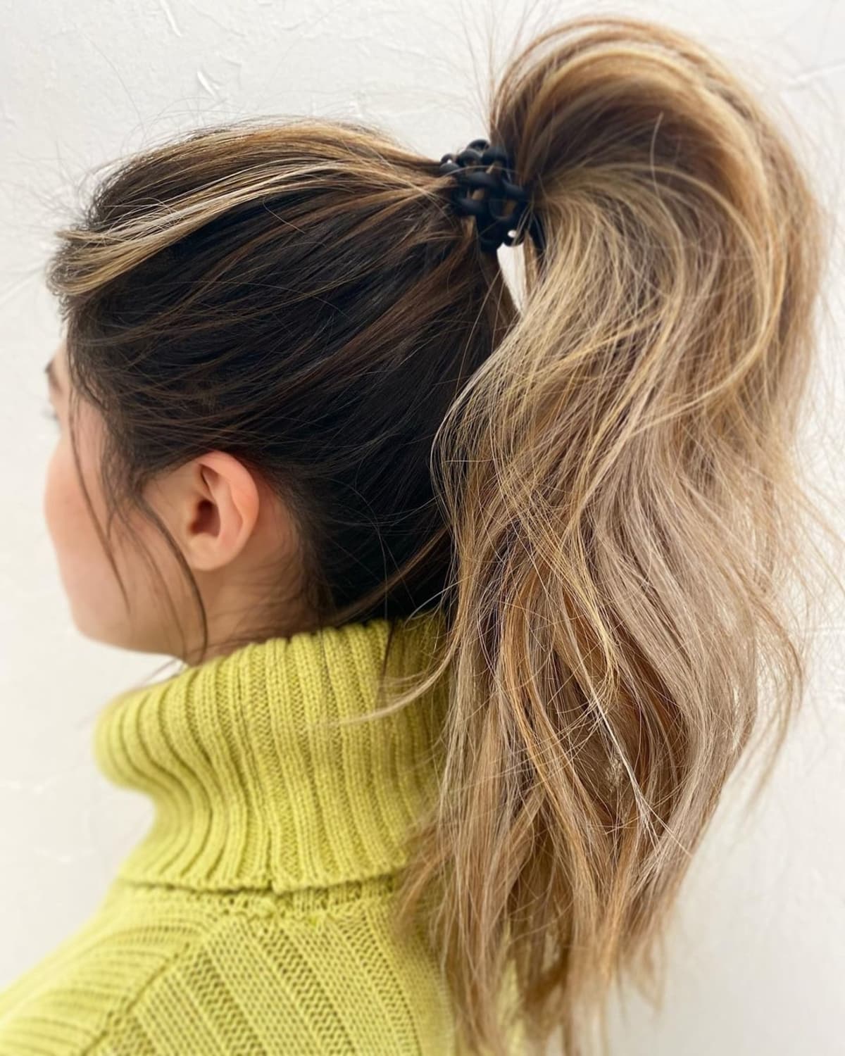 messy and textured high ponytail
