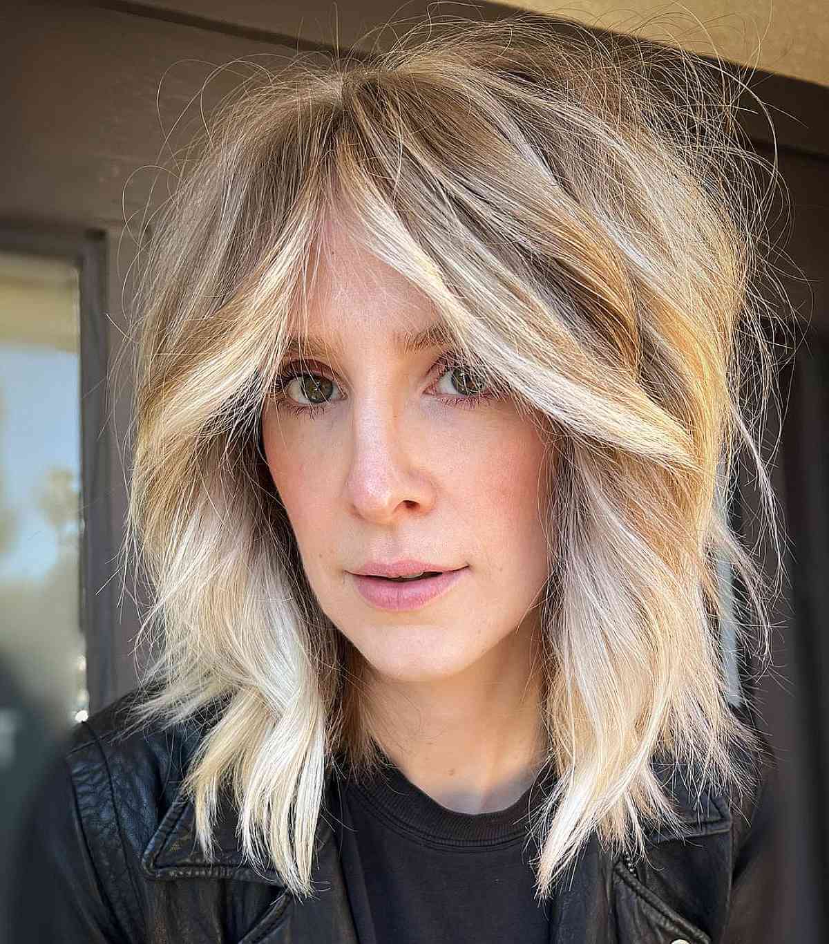 mid length shag with bottleneck fringe bangs for ladies over 40