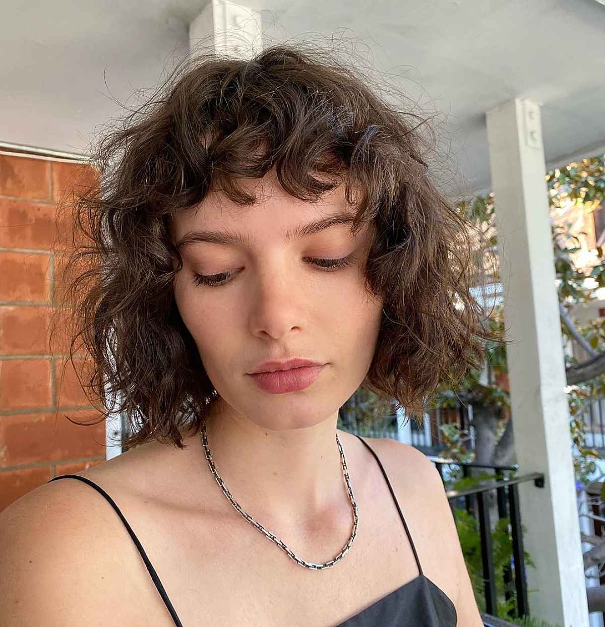mid length wavy bob with bangs and layers for ladies passed 30