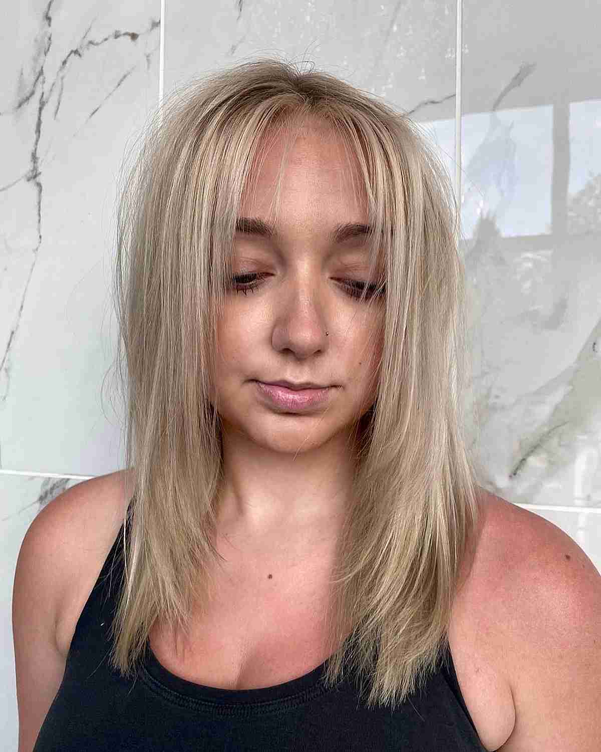middle part and sleek subtle layers for thinning hair