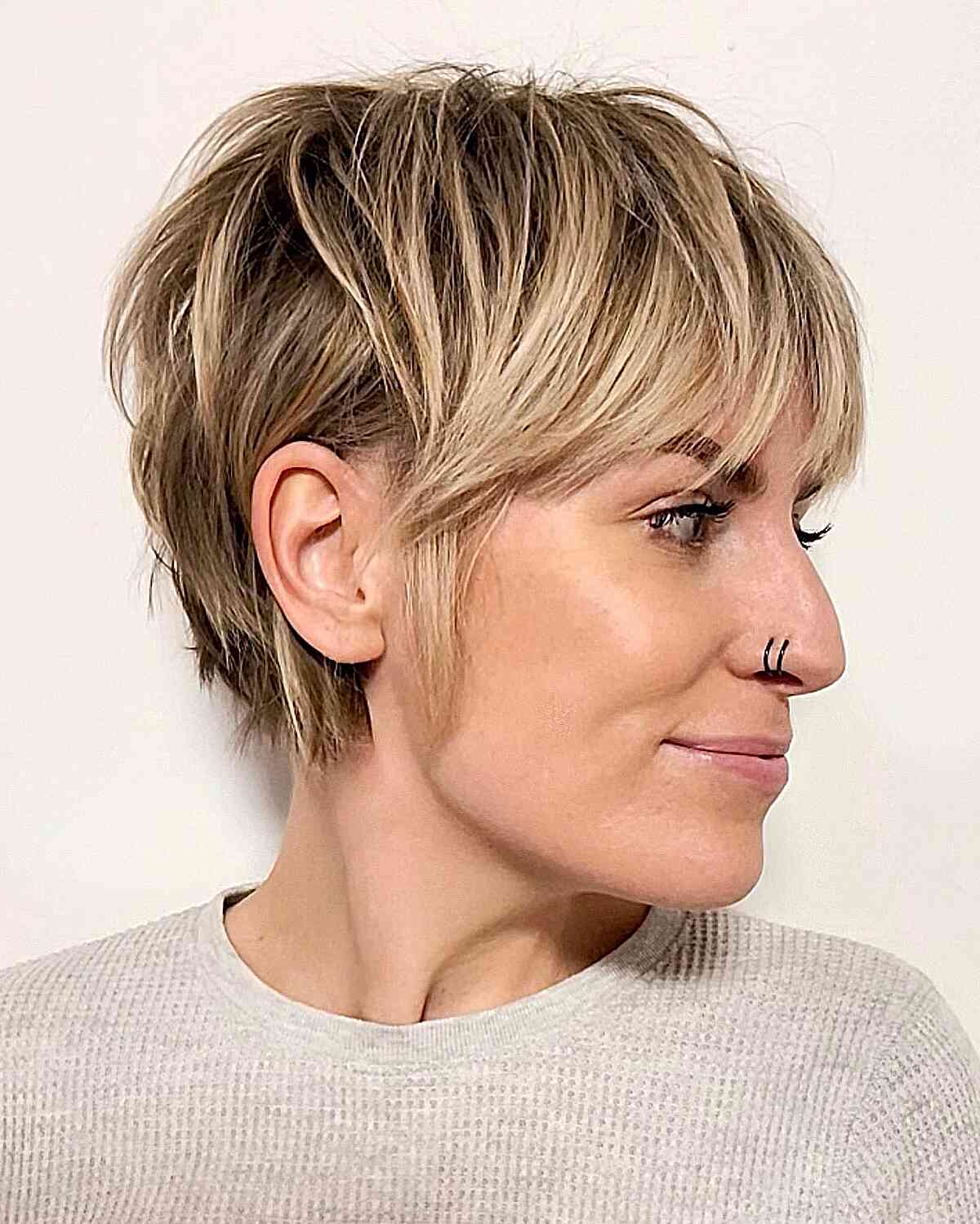 modern pixie haircut with wispy bangs