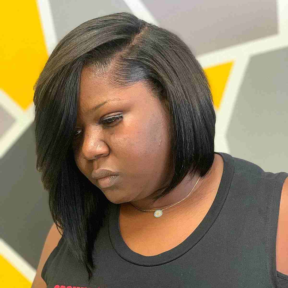 multi layered asymmetrical bob cut for a black woman over 40