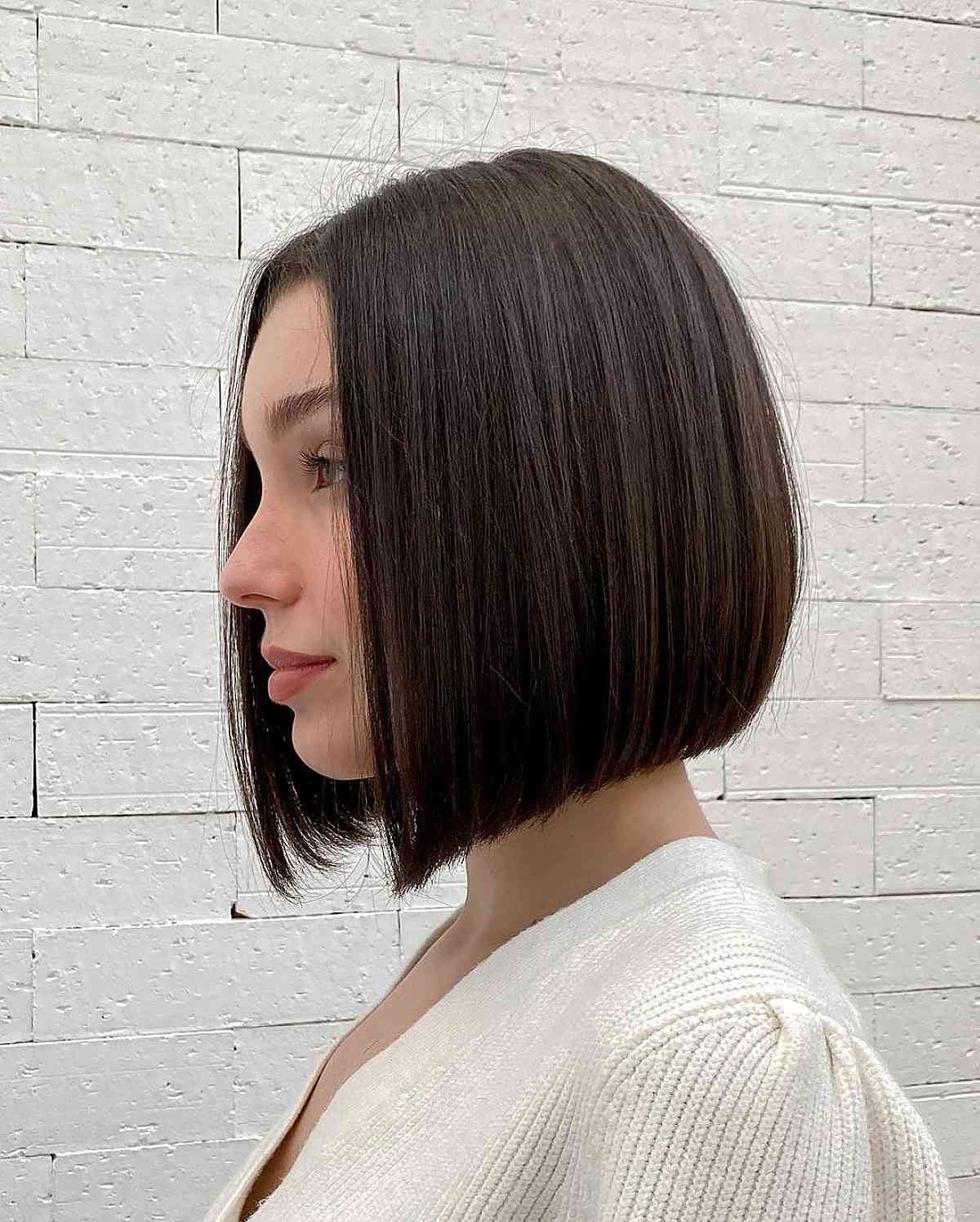 neck length sleek bob with a middle part