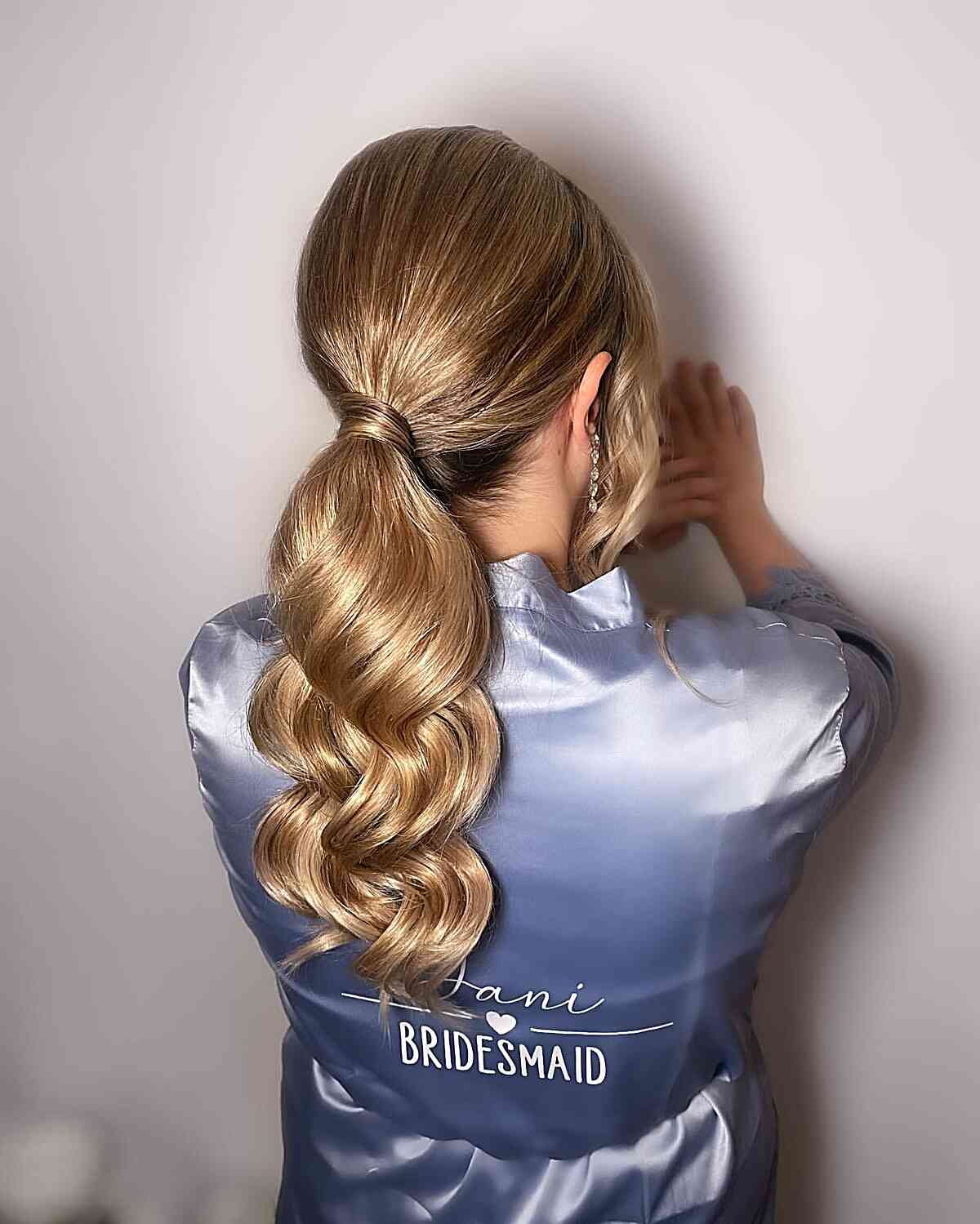 perfectly polished pony smooth blonde ponytail back view