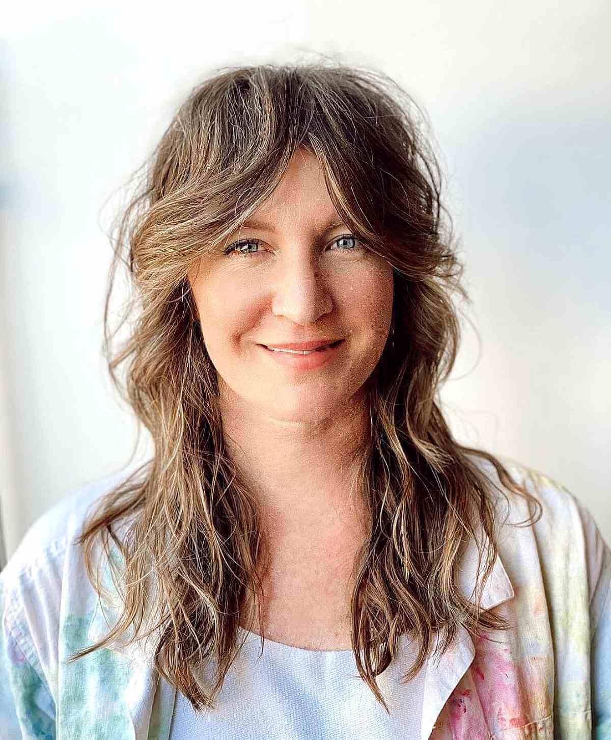 razored shag with long curtain bangs for a 40 year old lady