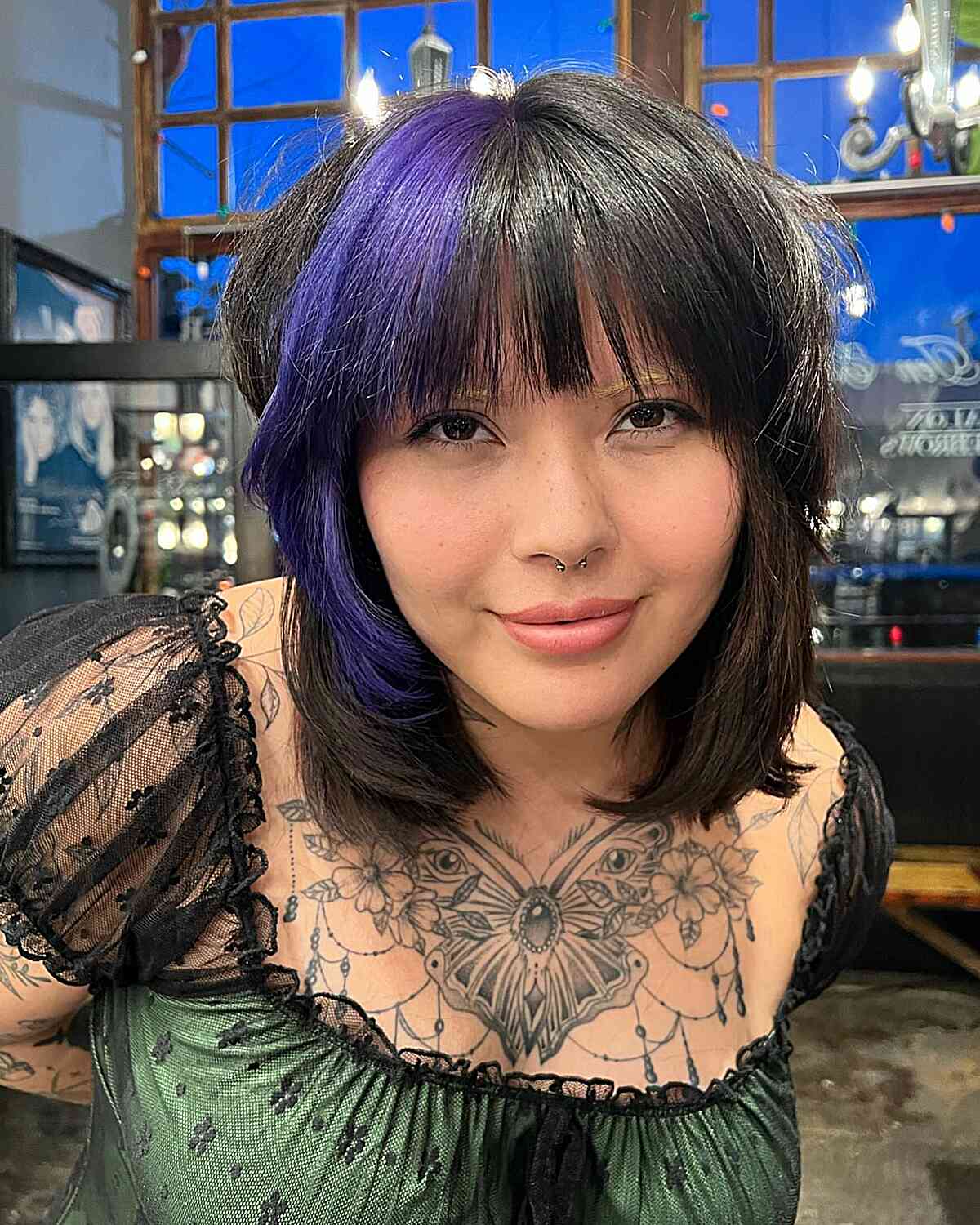 short and edgy wolf cut with chunky violet hue for ladies with prominent cheekbones