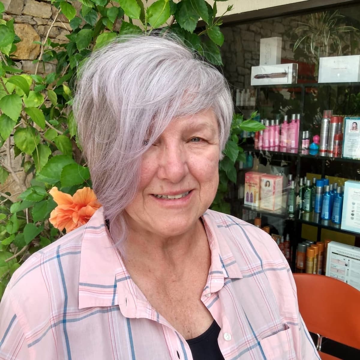 short asymmetrical haircut on older women with gray hair