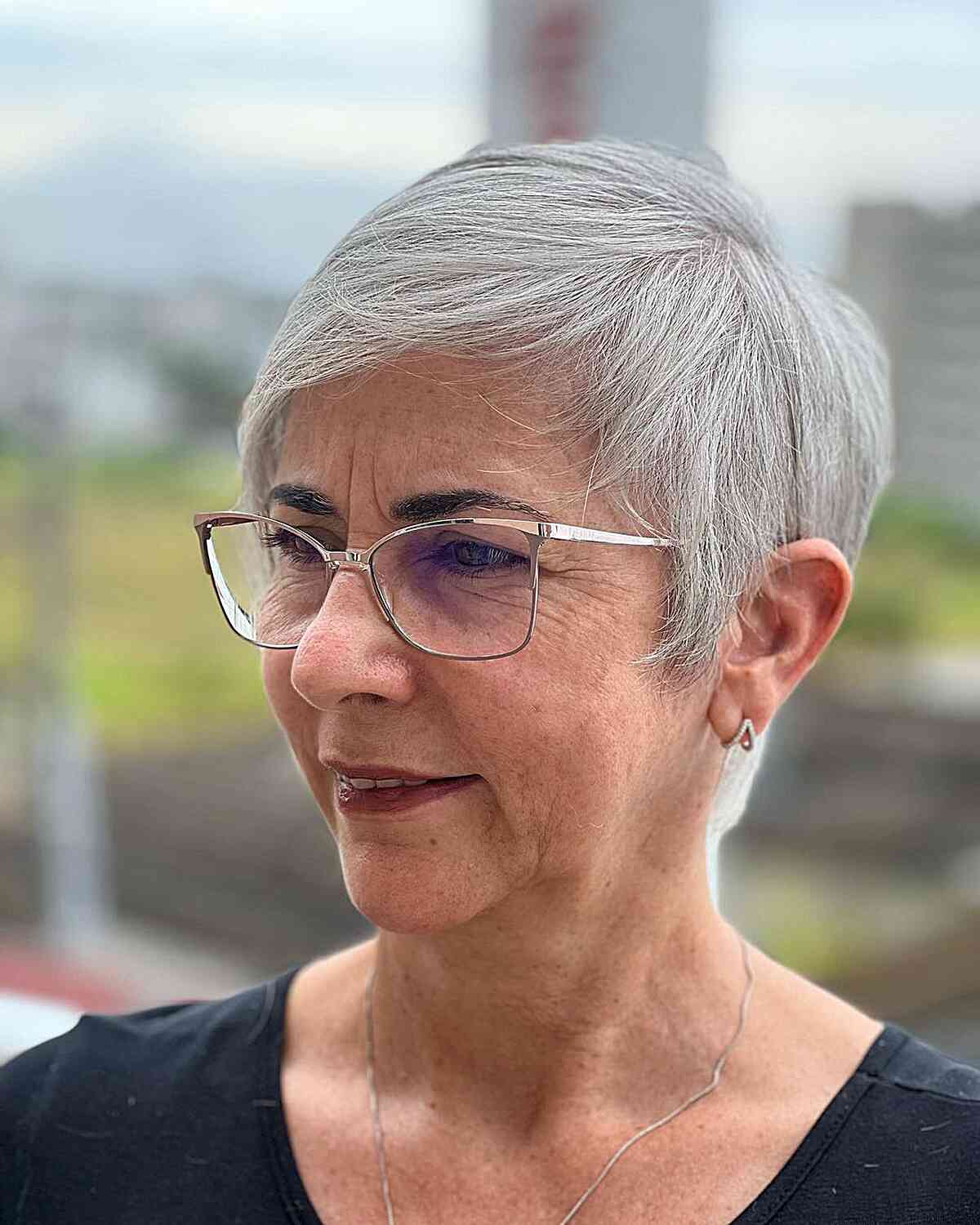 short crop cut with airy bangs for 60 year old women with glasses