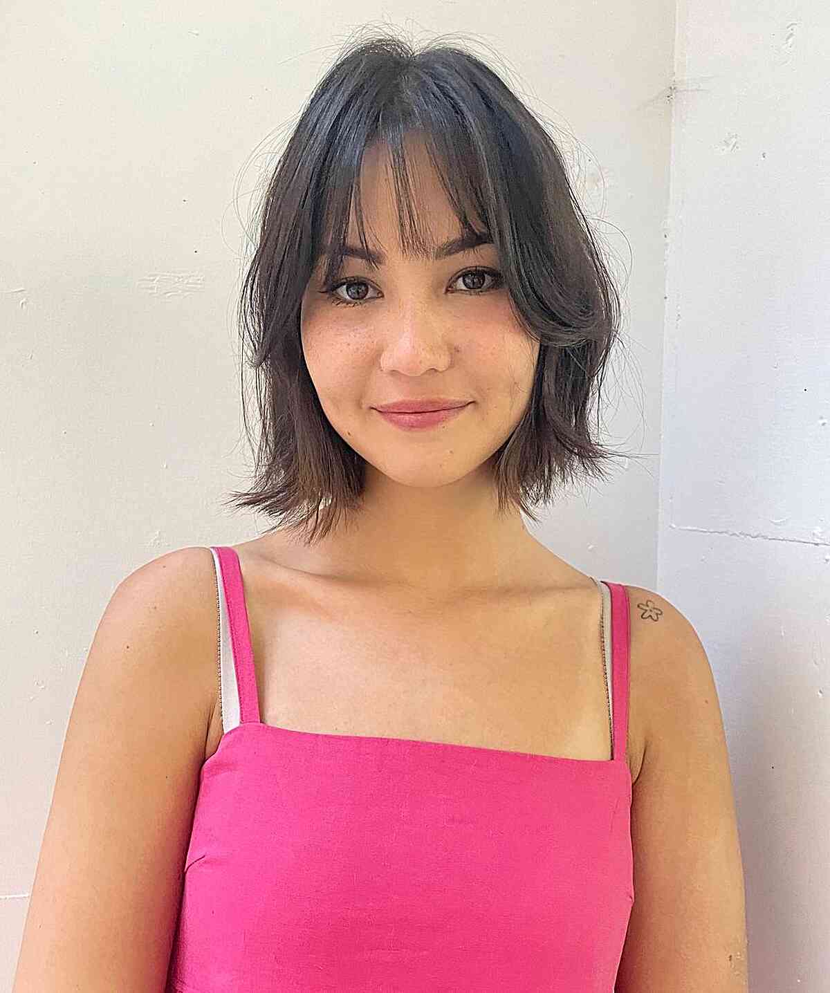 short face framing soft bob with curtain bangs for fuller faces