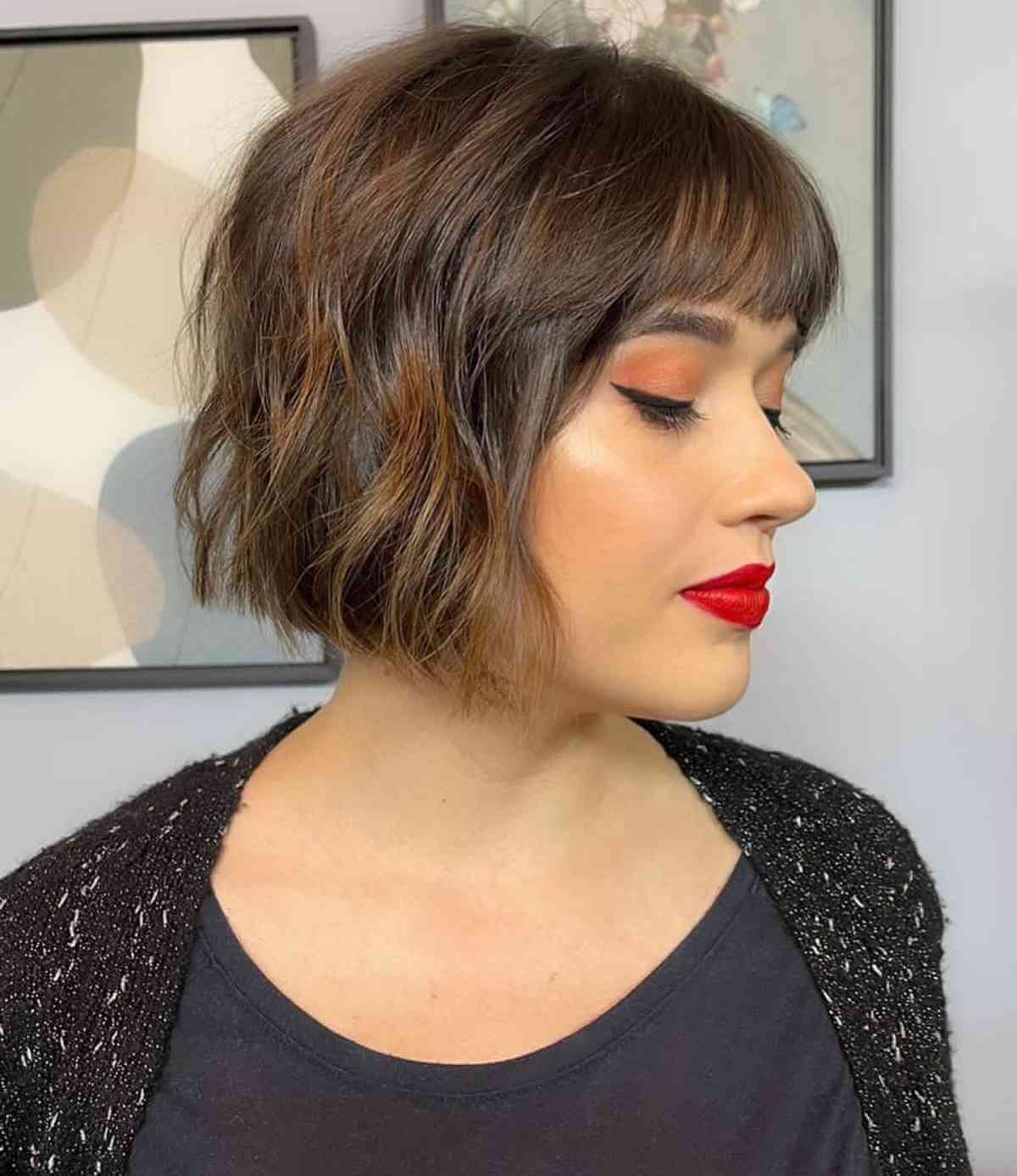 short hair with blunt bangs and a heart face shape