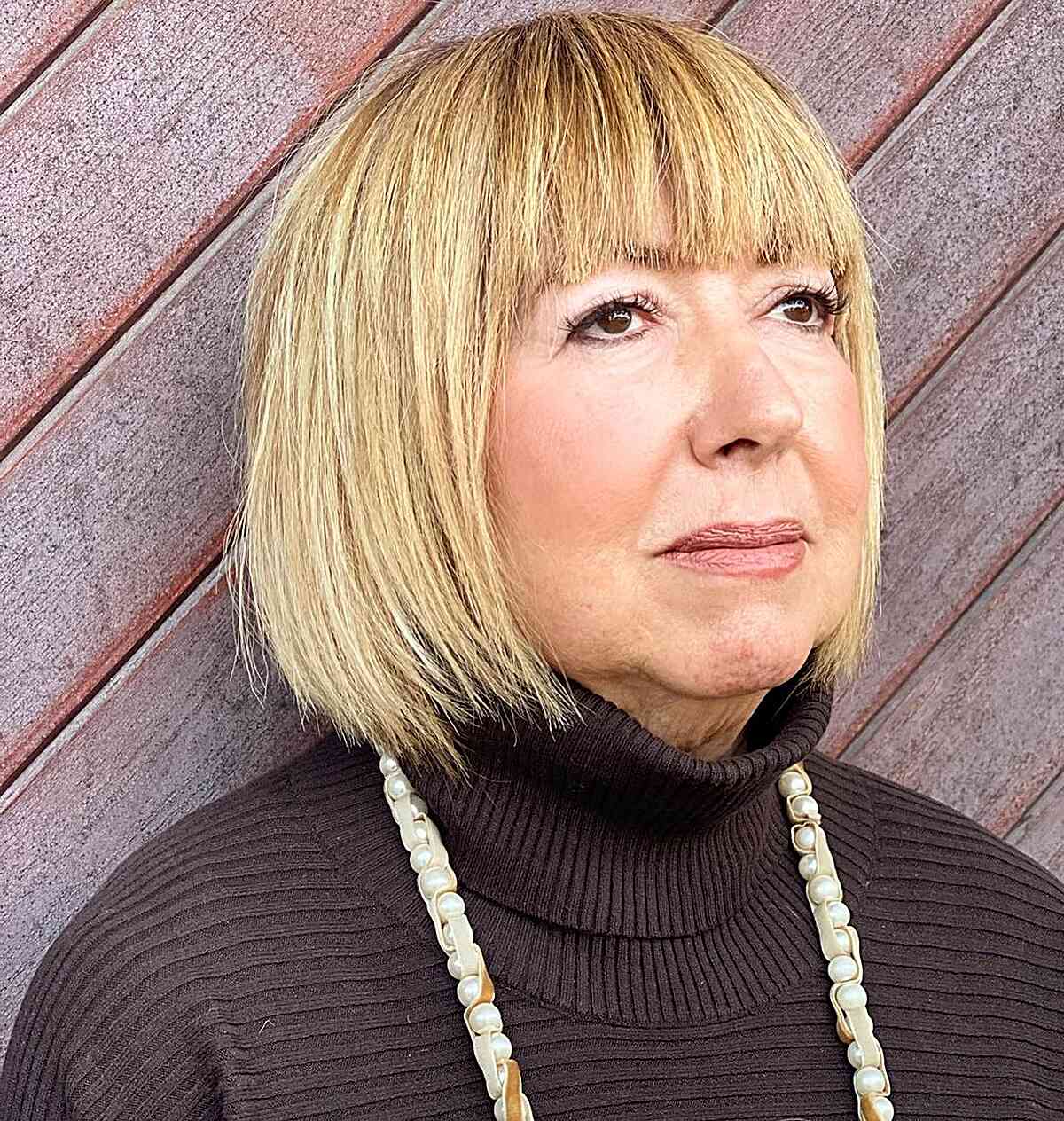 short length straight bob with jagged ends and bangs on older women with round faces