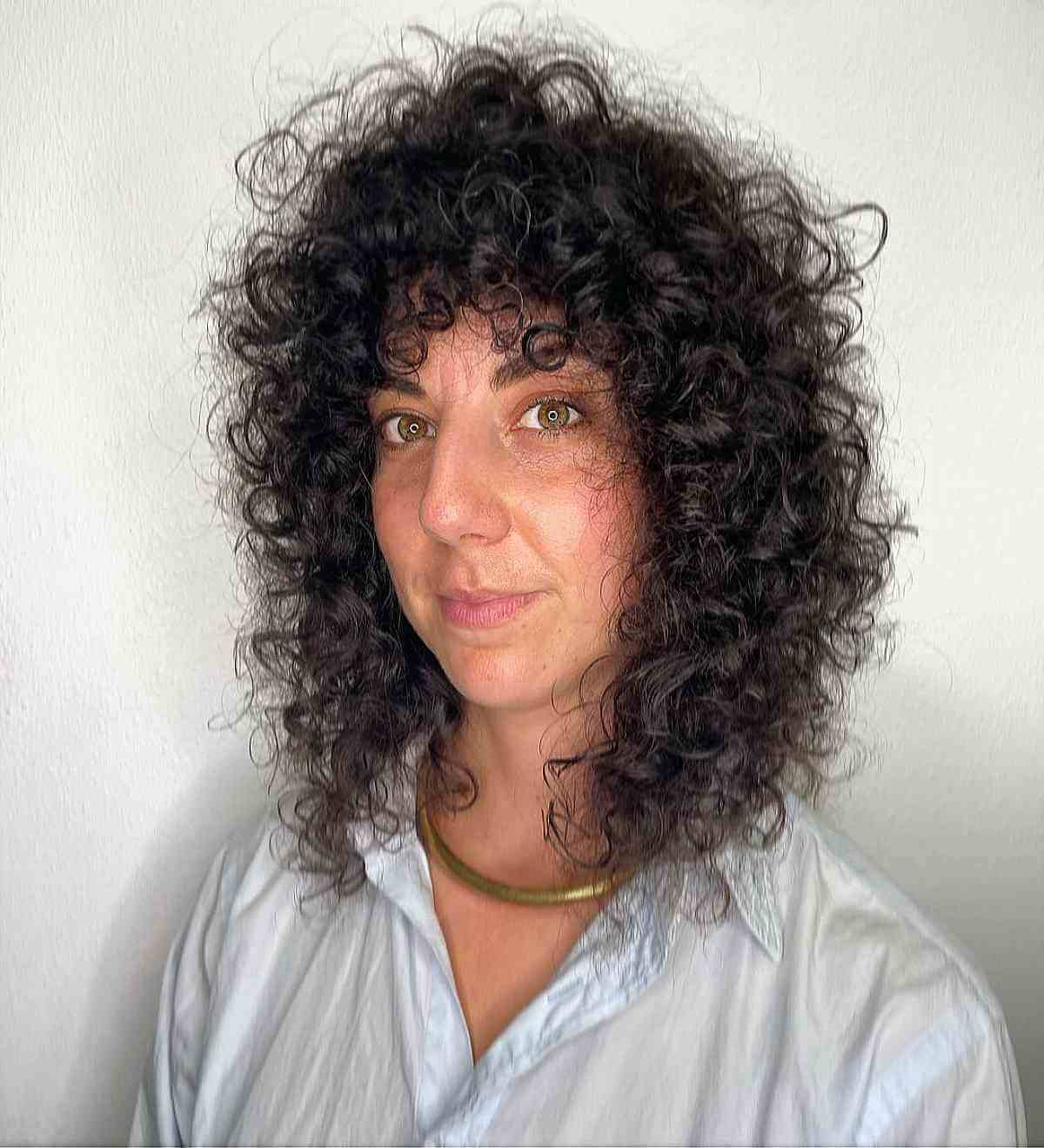 shoulder length curly shag for a lady in her 40s