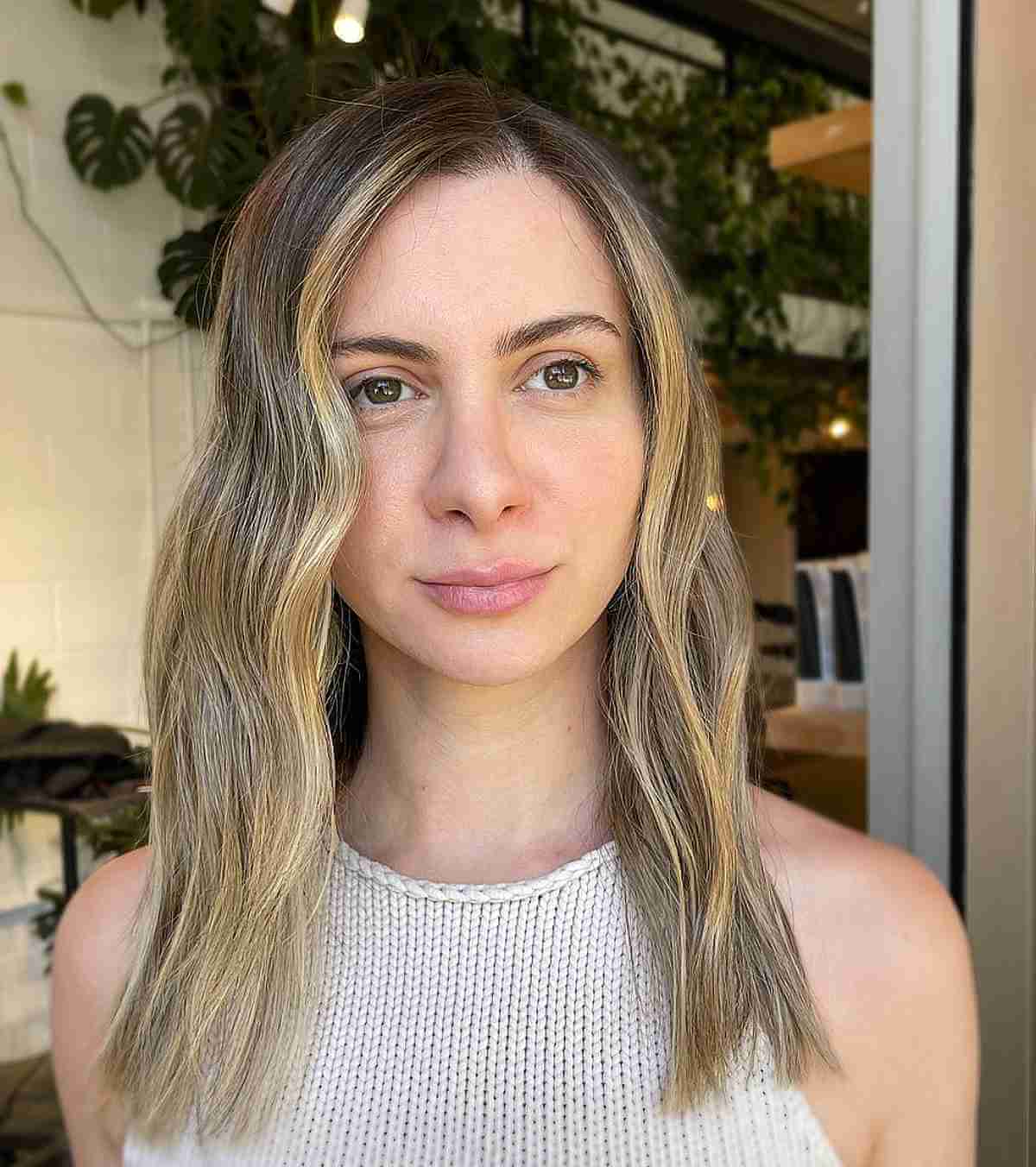 side part medium length thinning hair with sun kissed balayage