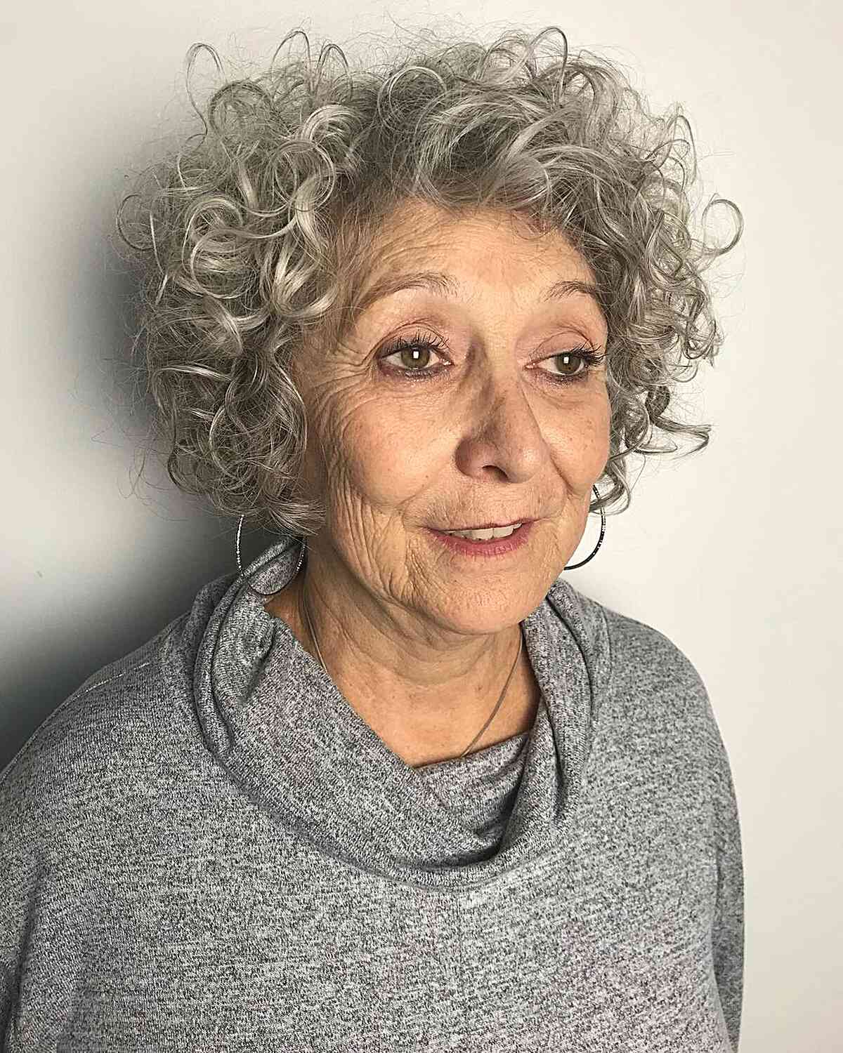 silver grey hair with bouncy curls for seniors aged sixty