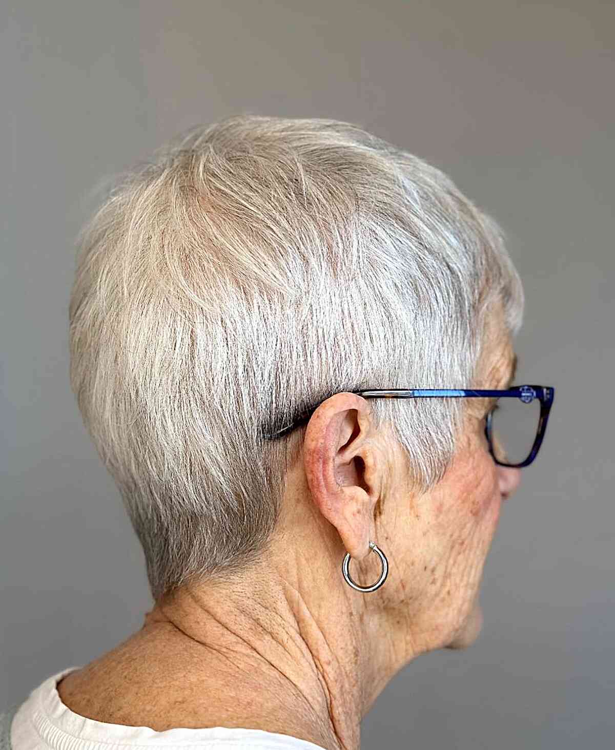 sleek cropped pixie cut for 60 year old ladies with specs