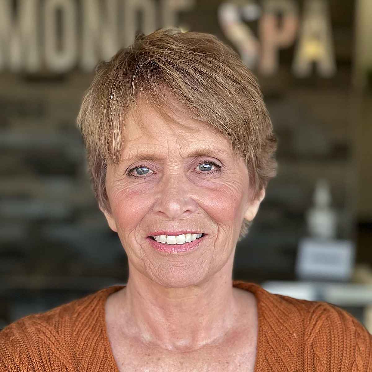 soft pixie haircut with side bangs on older women