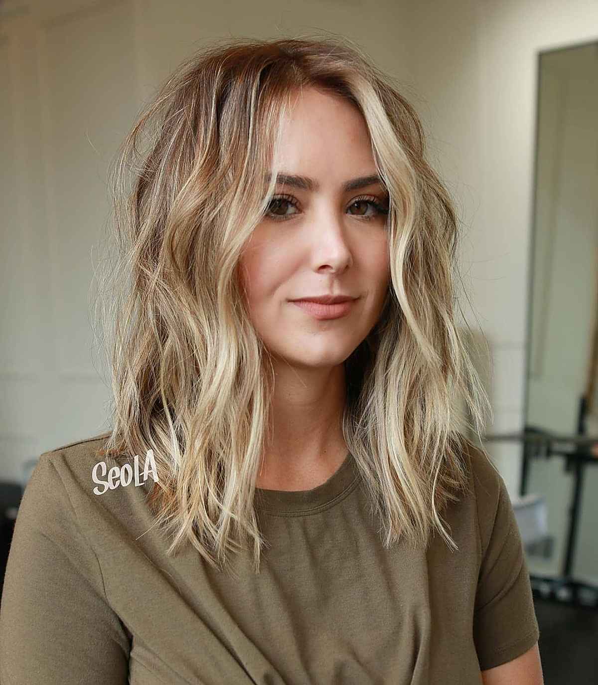 textured shoulder length shag cut for a heart face