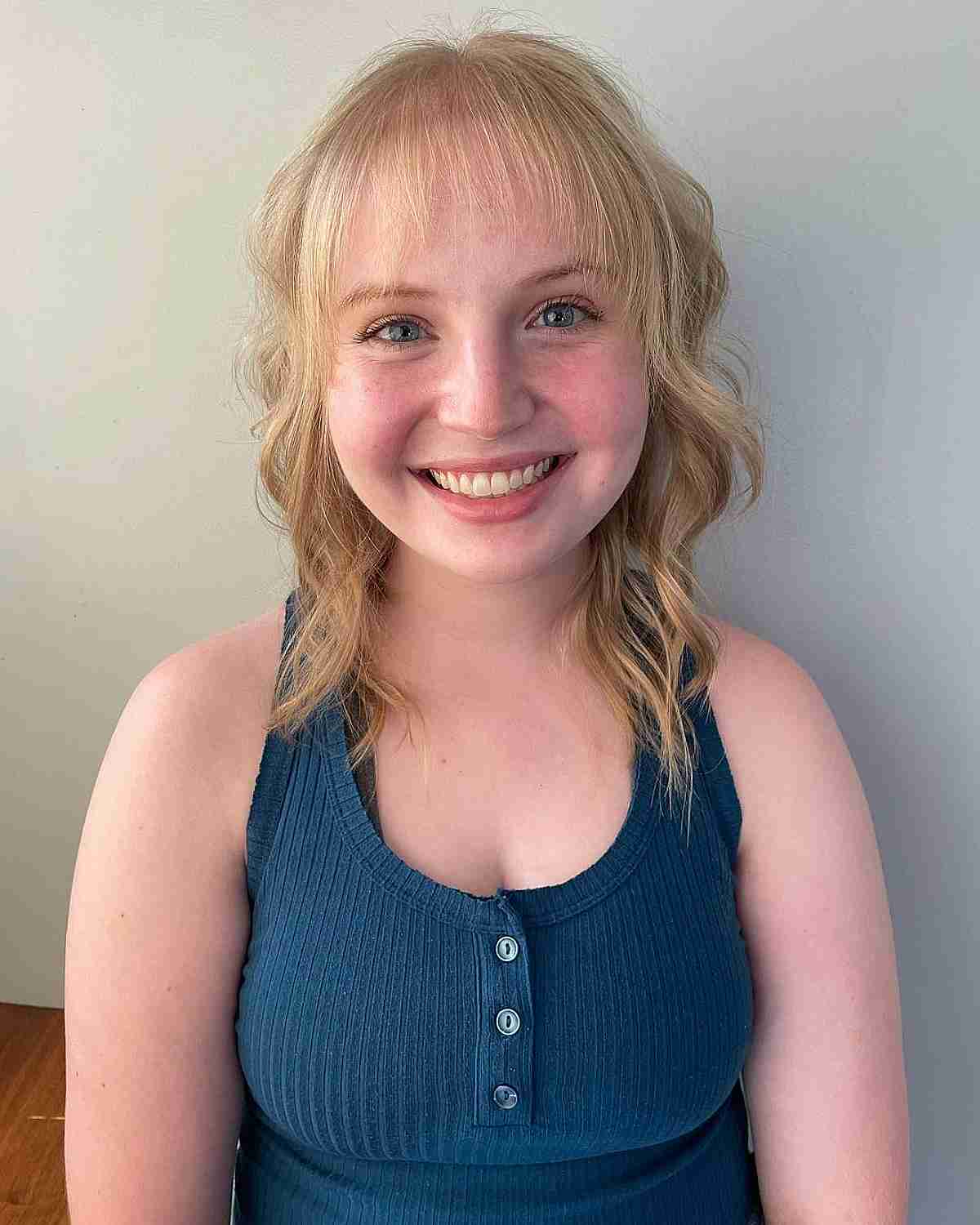 thin soft bangs and layers on mid length hair