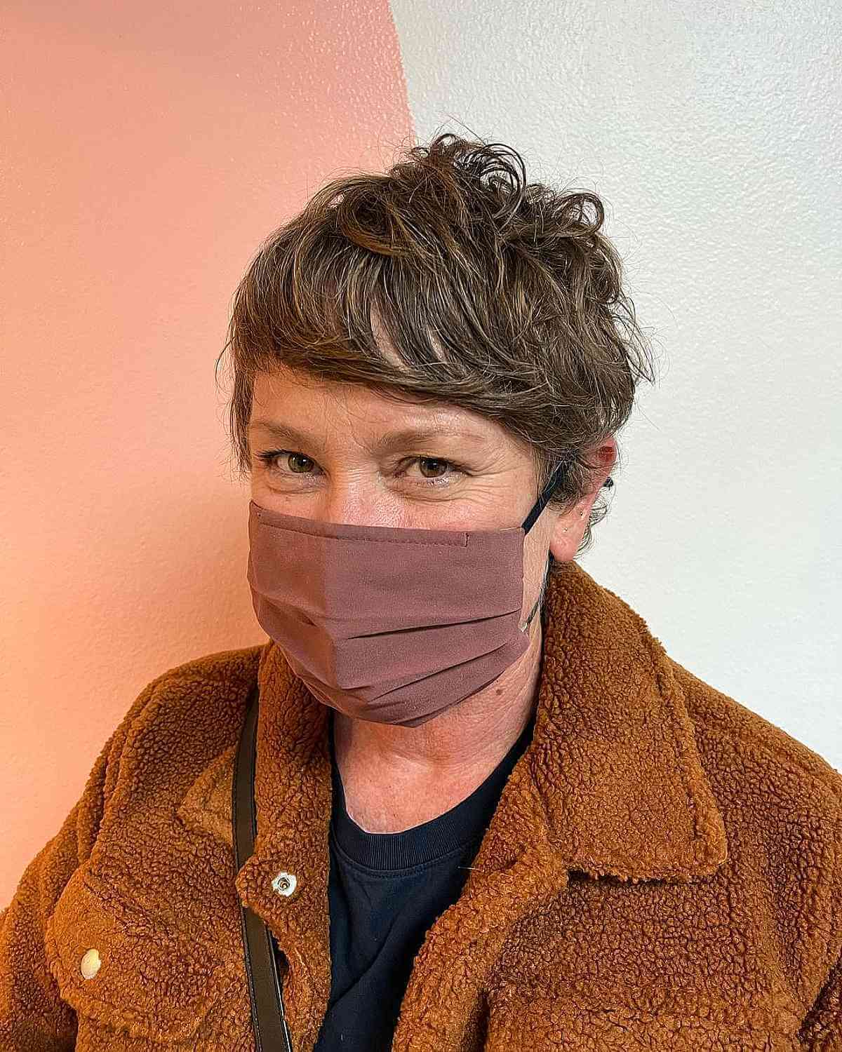 tousled pixie shag with side swept bangs for an old woman