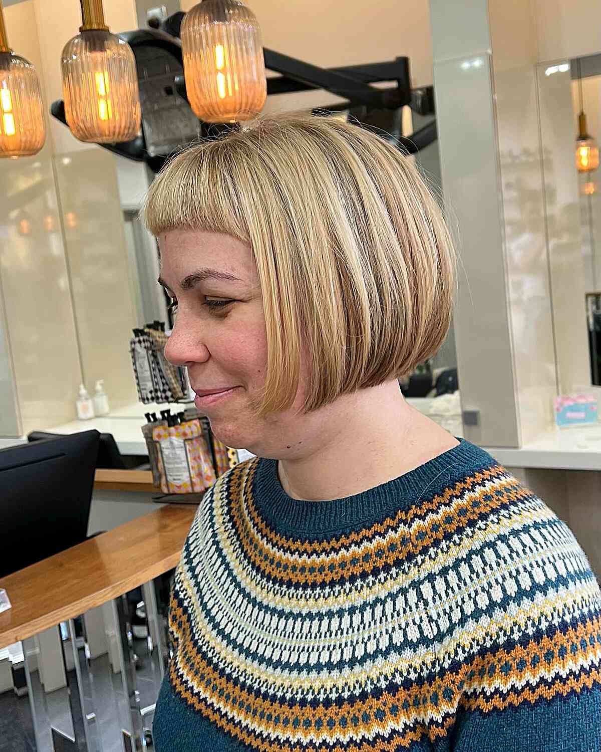 very short classic bob and arched bangs on ladies with double chins
