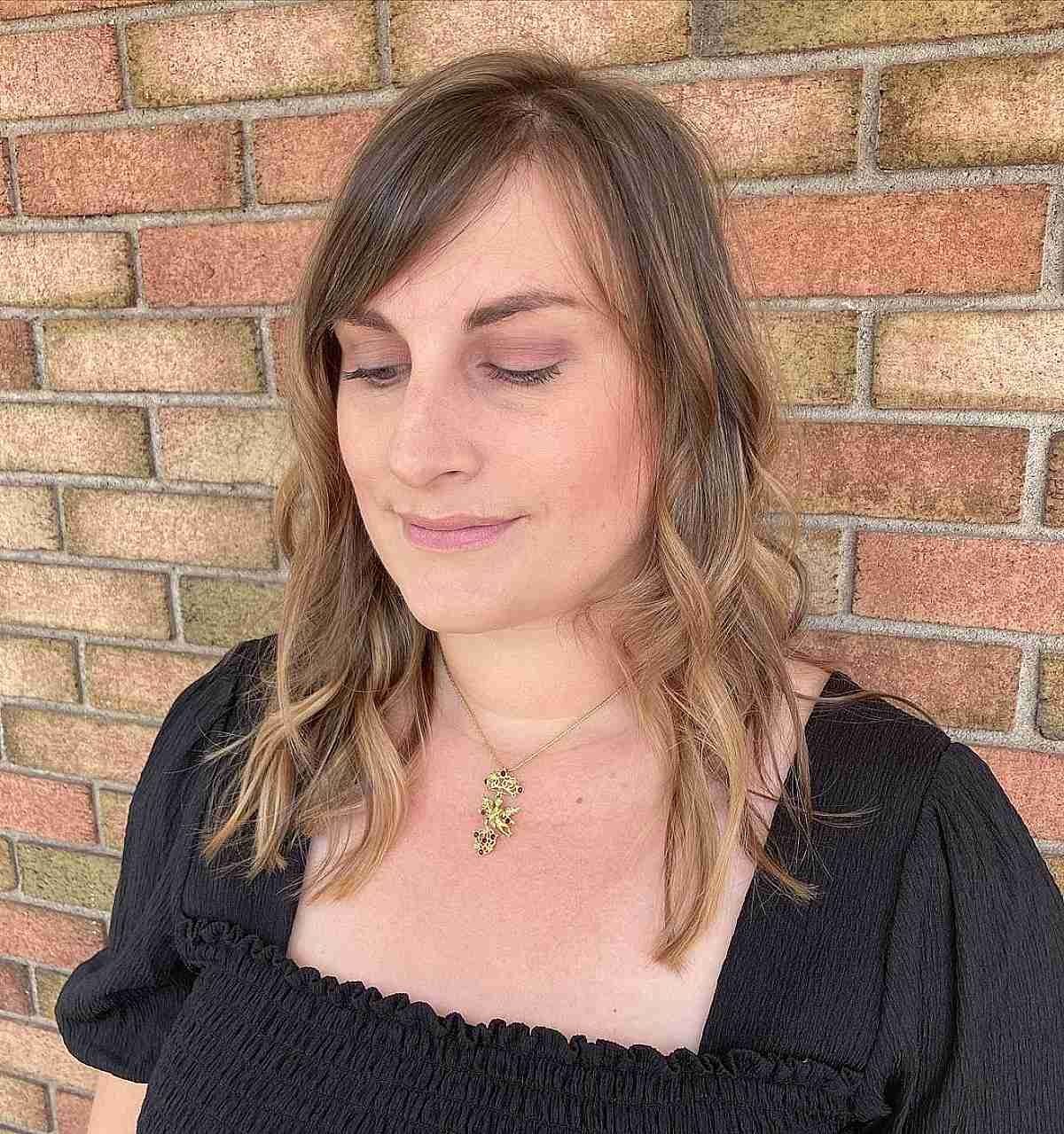 wavy razored cut with side bangs for thinning hair