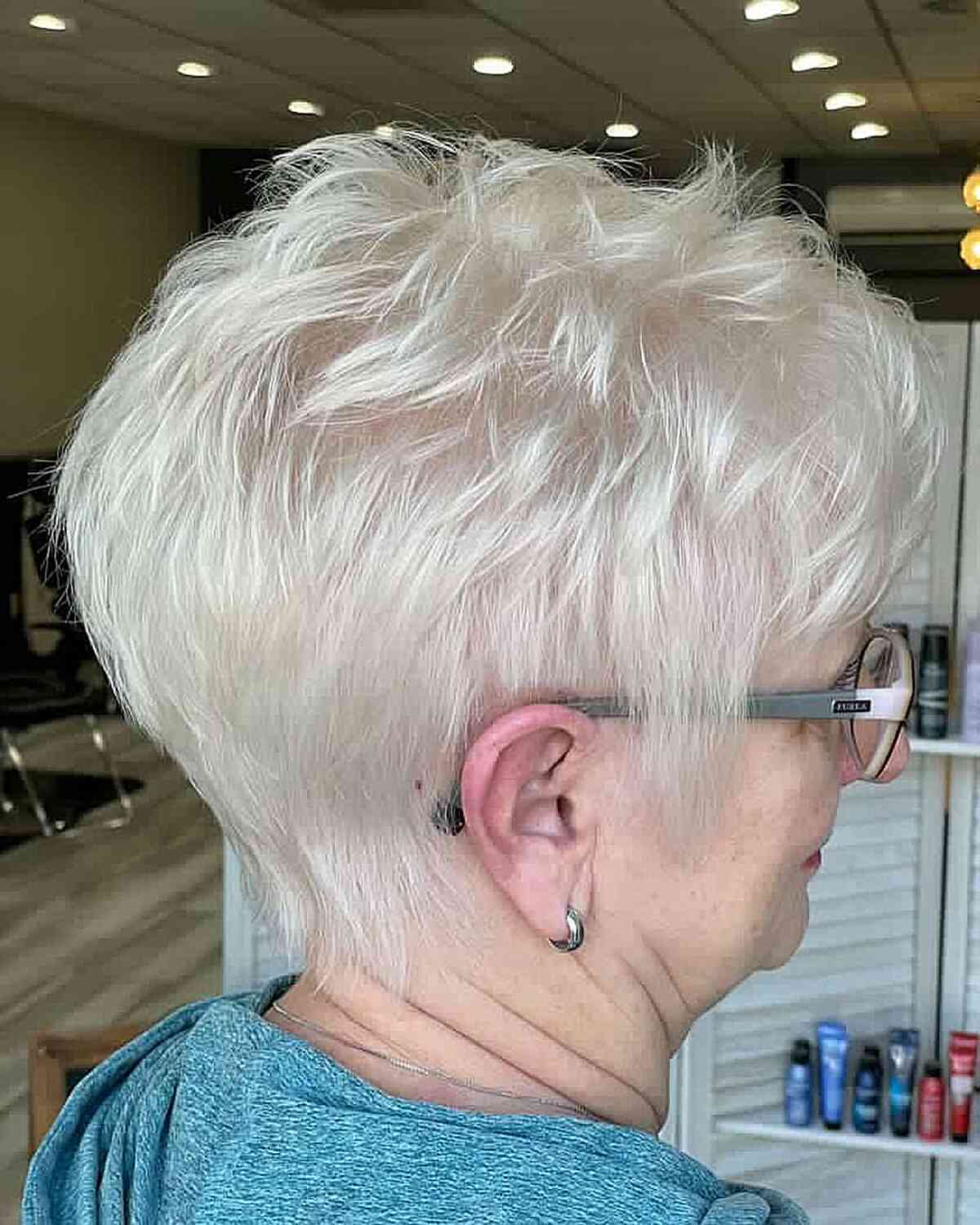 white pixie hair with short layers for women over 60 years old with glasses