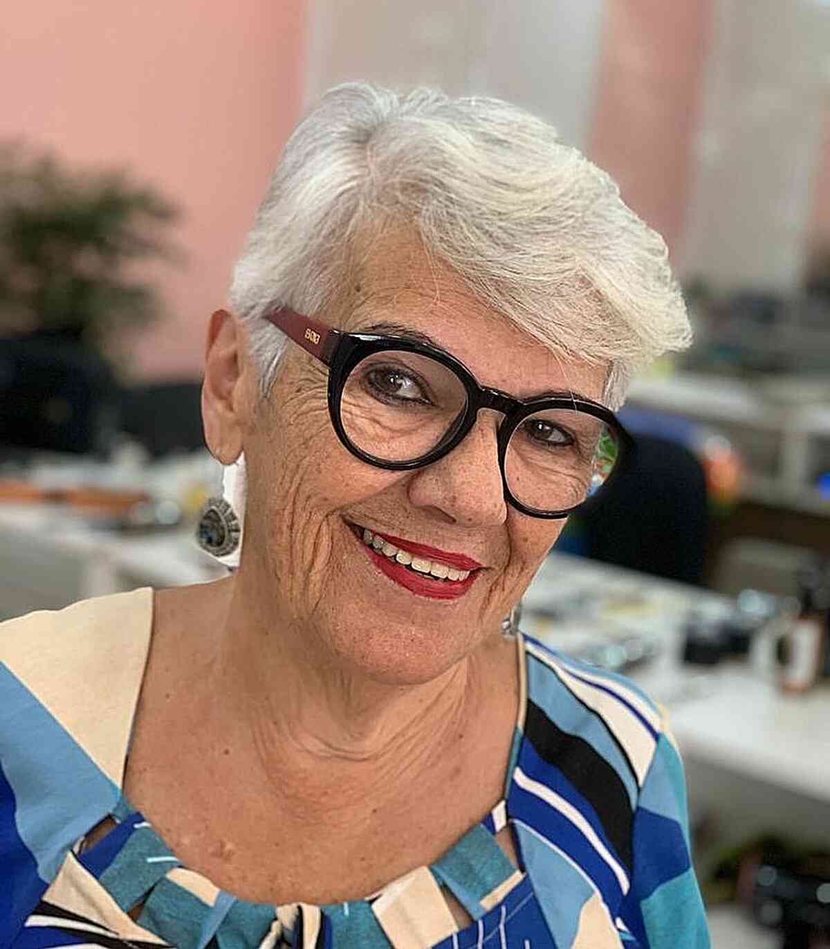 white pixie with swept fringe for women over 60 with specs