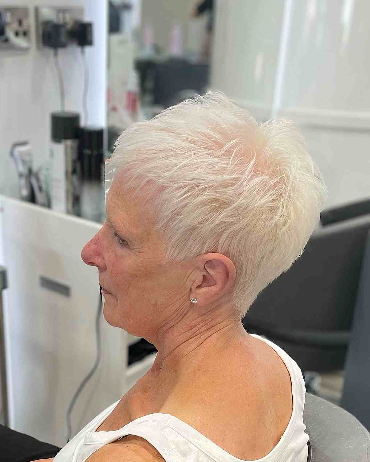 wispy blonde pixie with thinning choppy layers