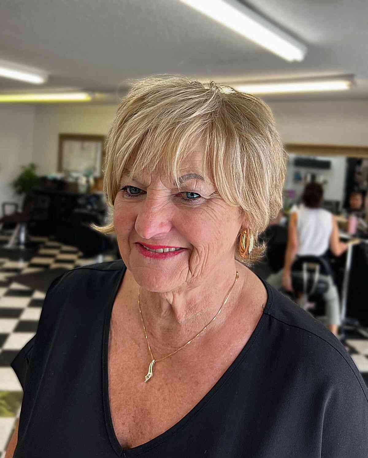 blonde pixie shaggy choppy bangs and flipped ends for older women