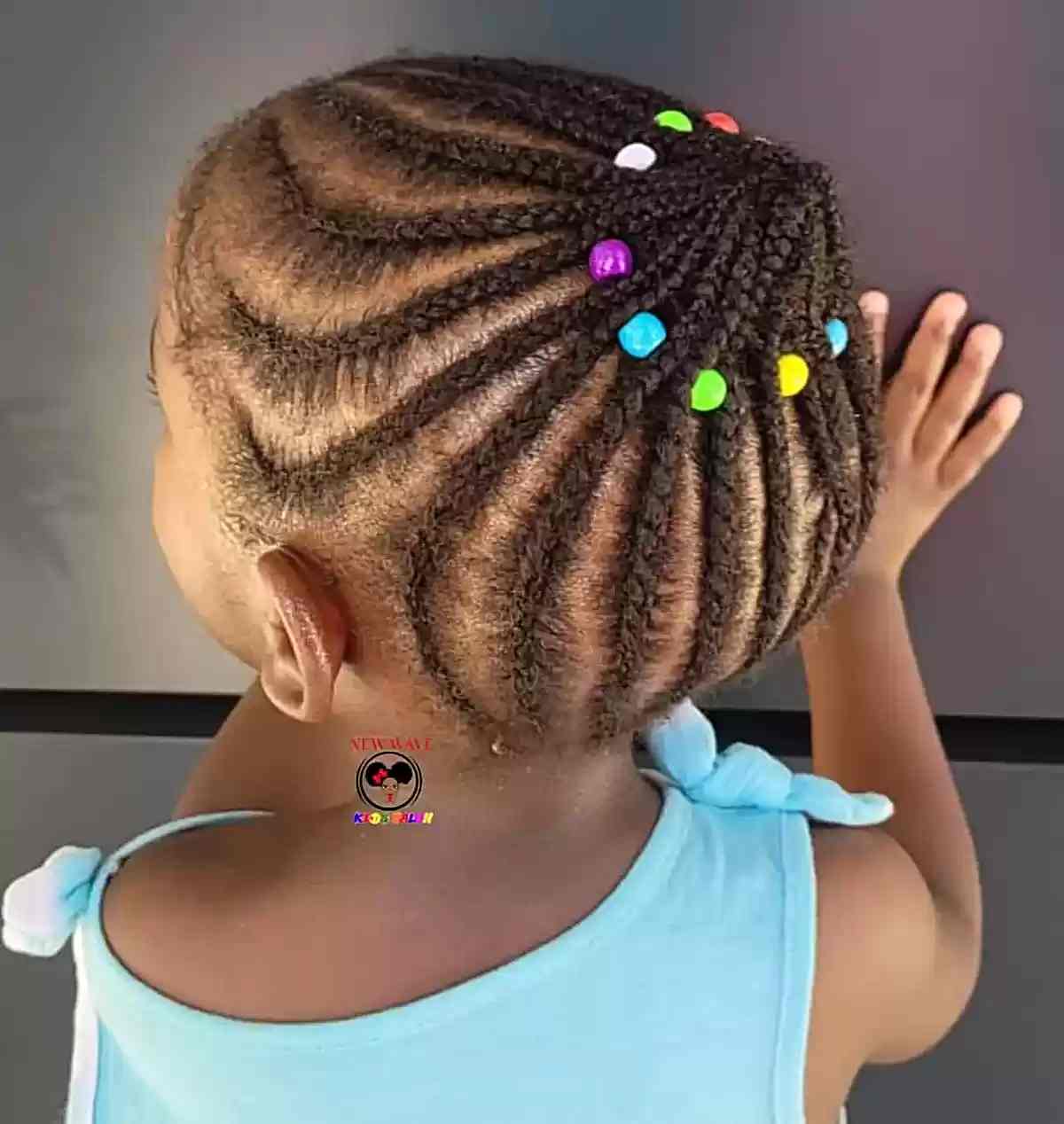 braided protective style updo with colorful beads for young black girls