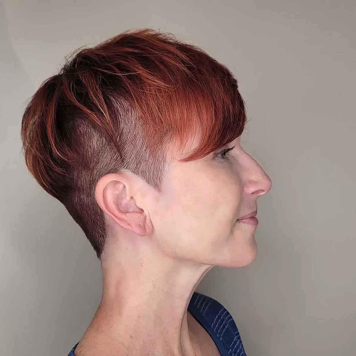 brick red pixie with an undercut