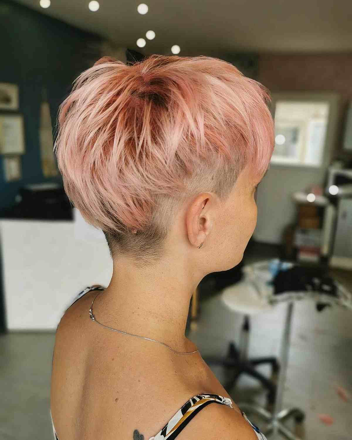 choppy pixie undercut on light pink hair