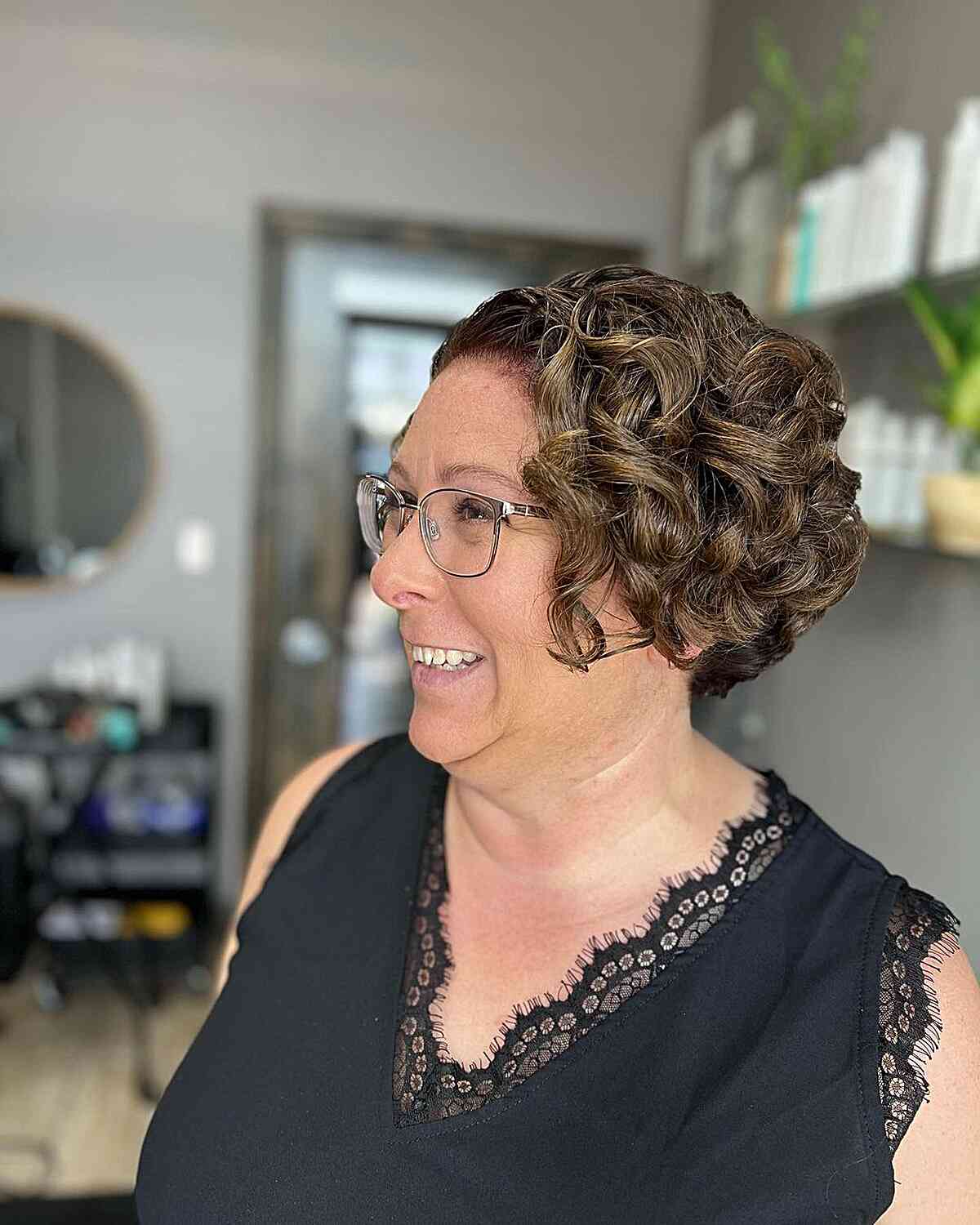 cropped bob with voluminous curls for mature old women