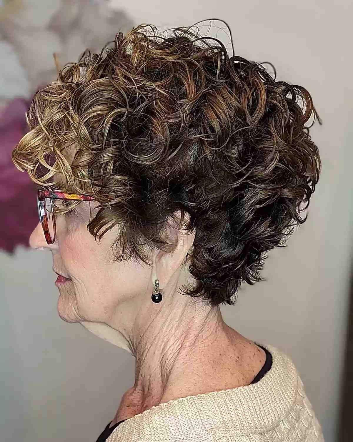 curled bixie brunette with hints of blonde on old women