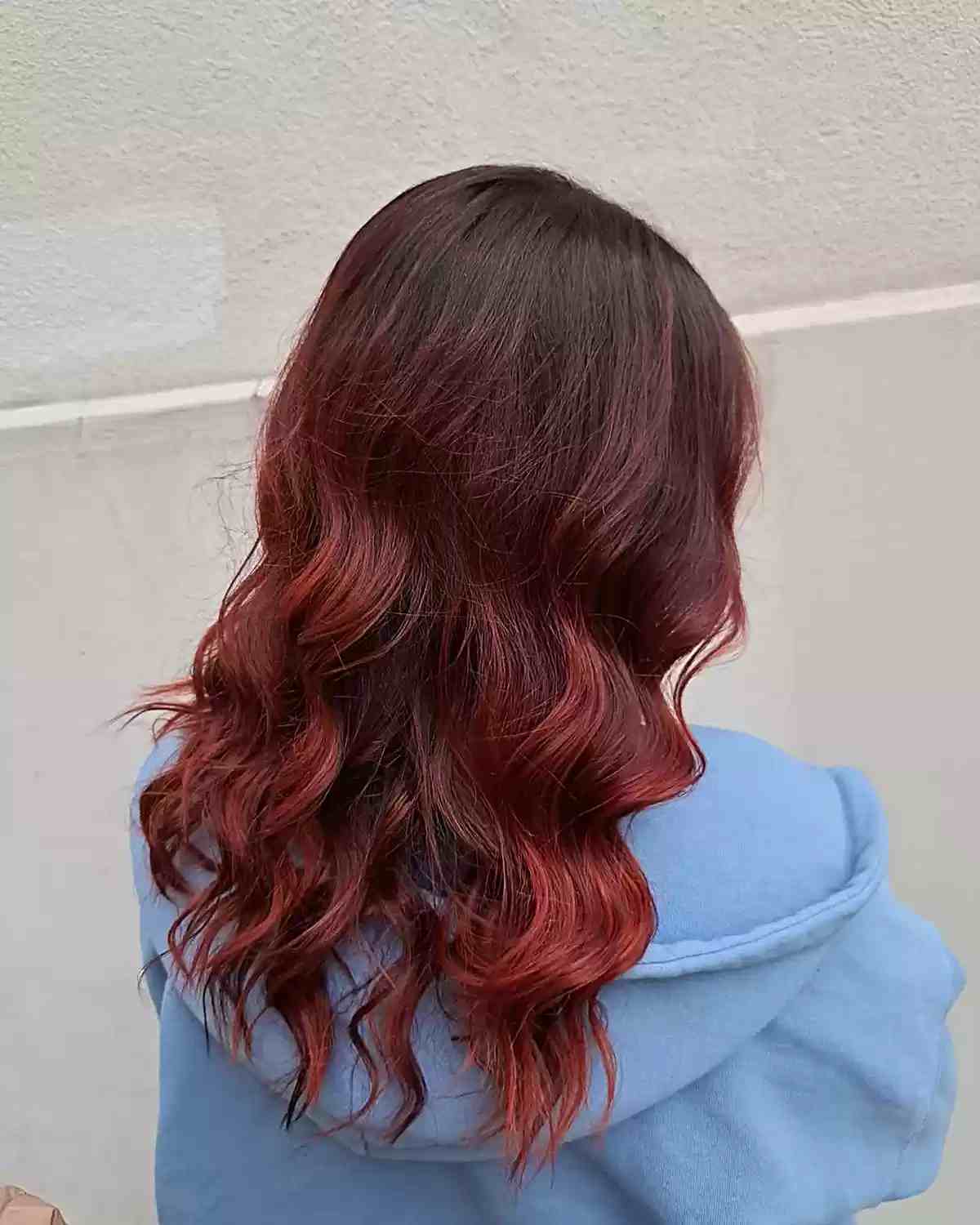dark flaming red color melt balayage on brown hair