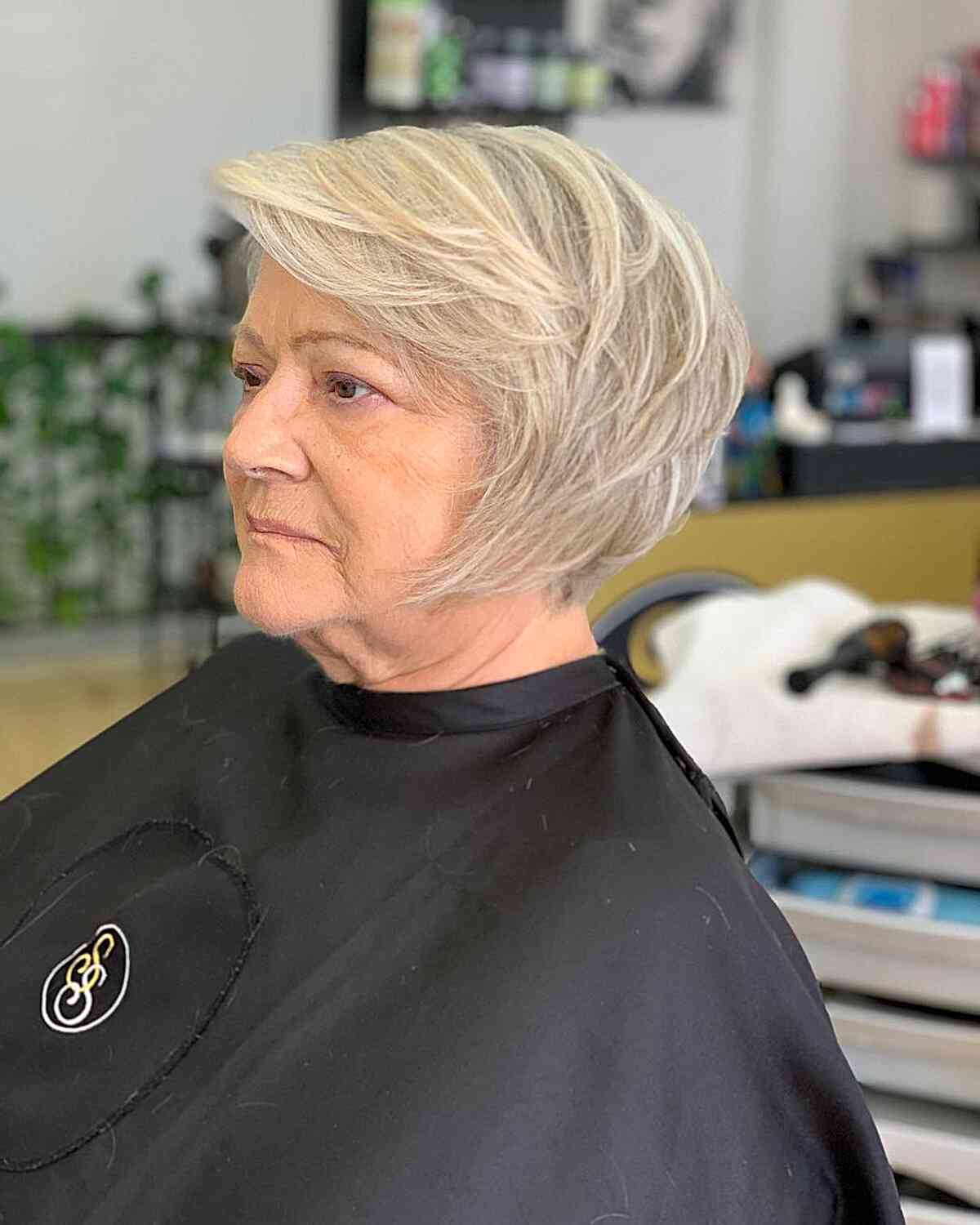 deep side part short jaw length hair with choppy layers for seniors over sixty