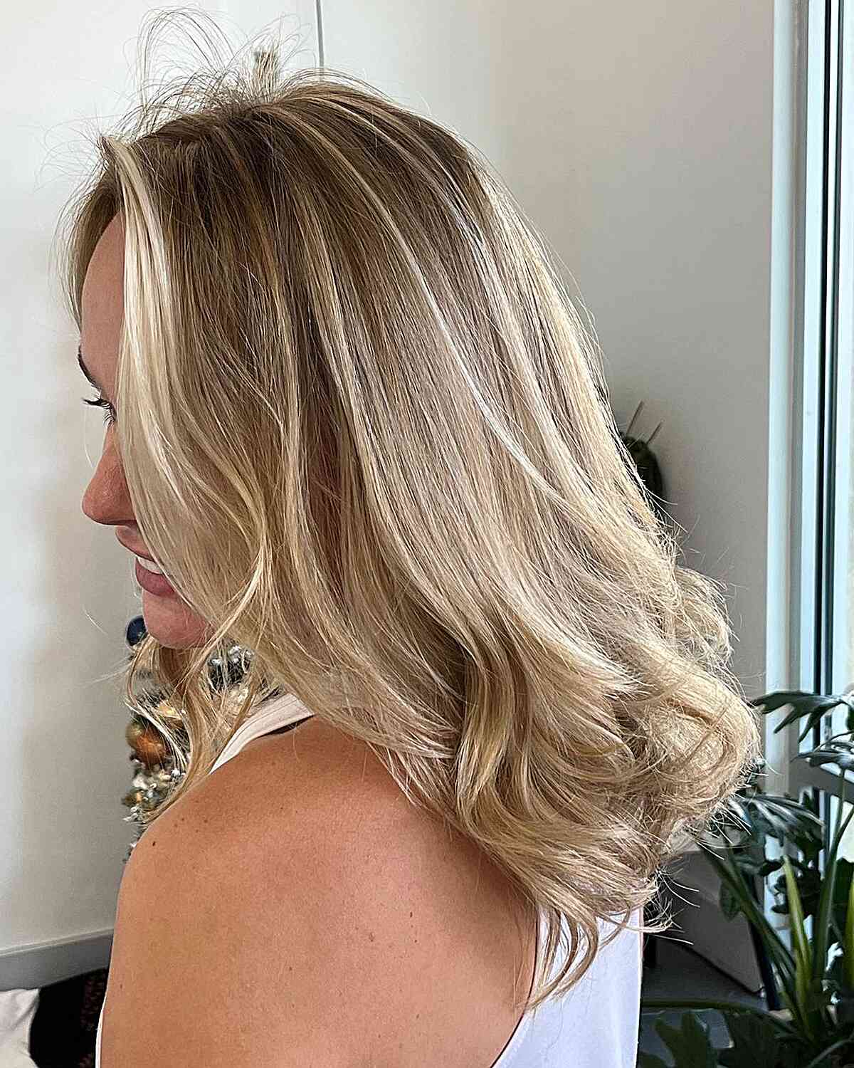 dirty bright blonde balayage with money piece