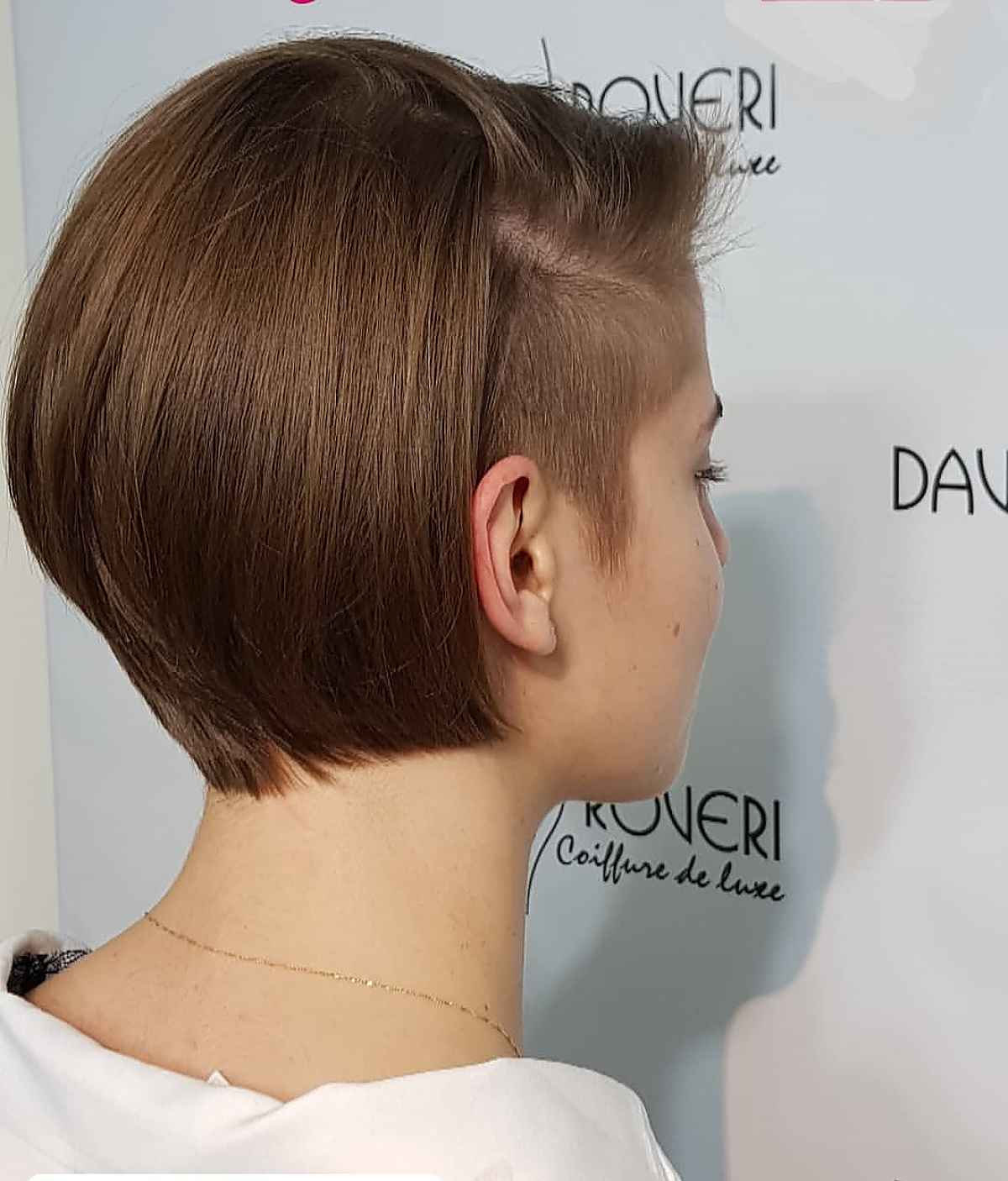 disconnected pixie bob undercut with a deep side part