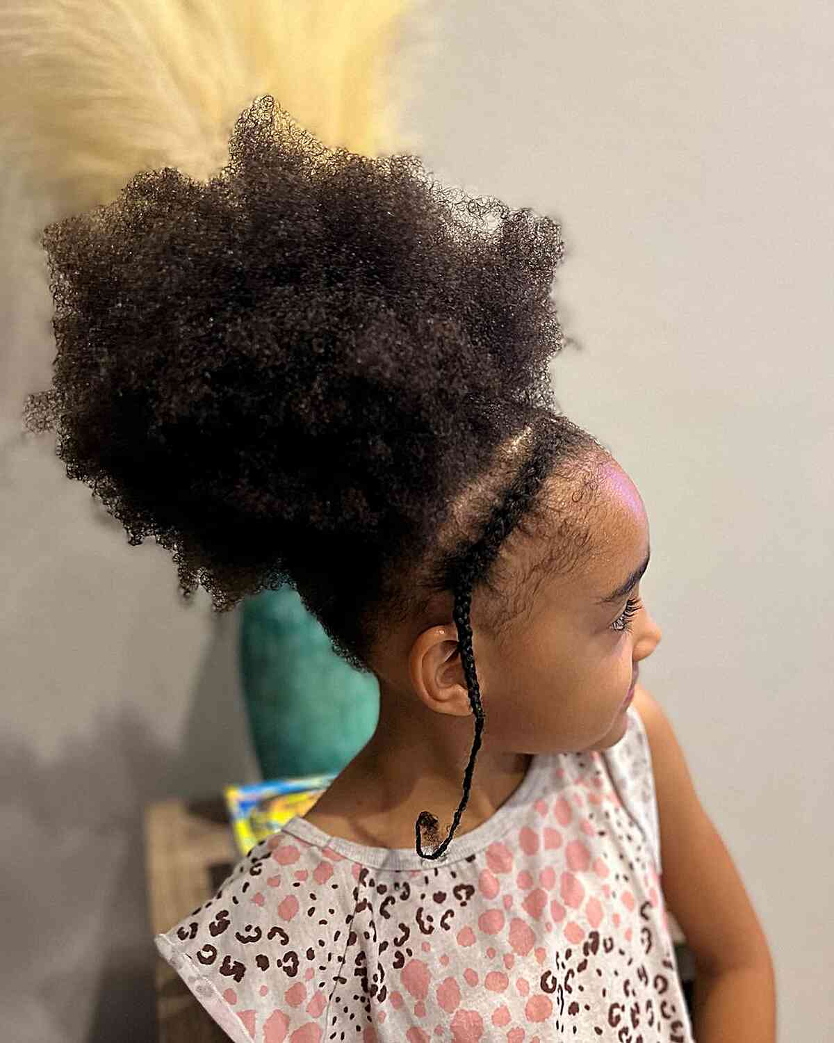 fluffy afro updo with braided headband for young black girls